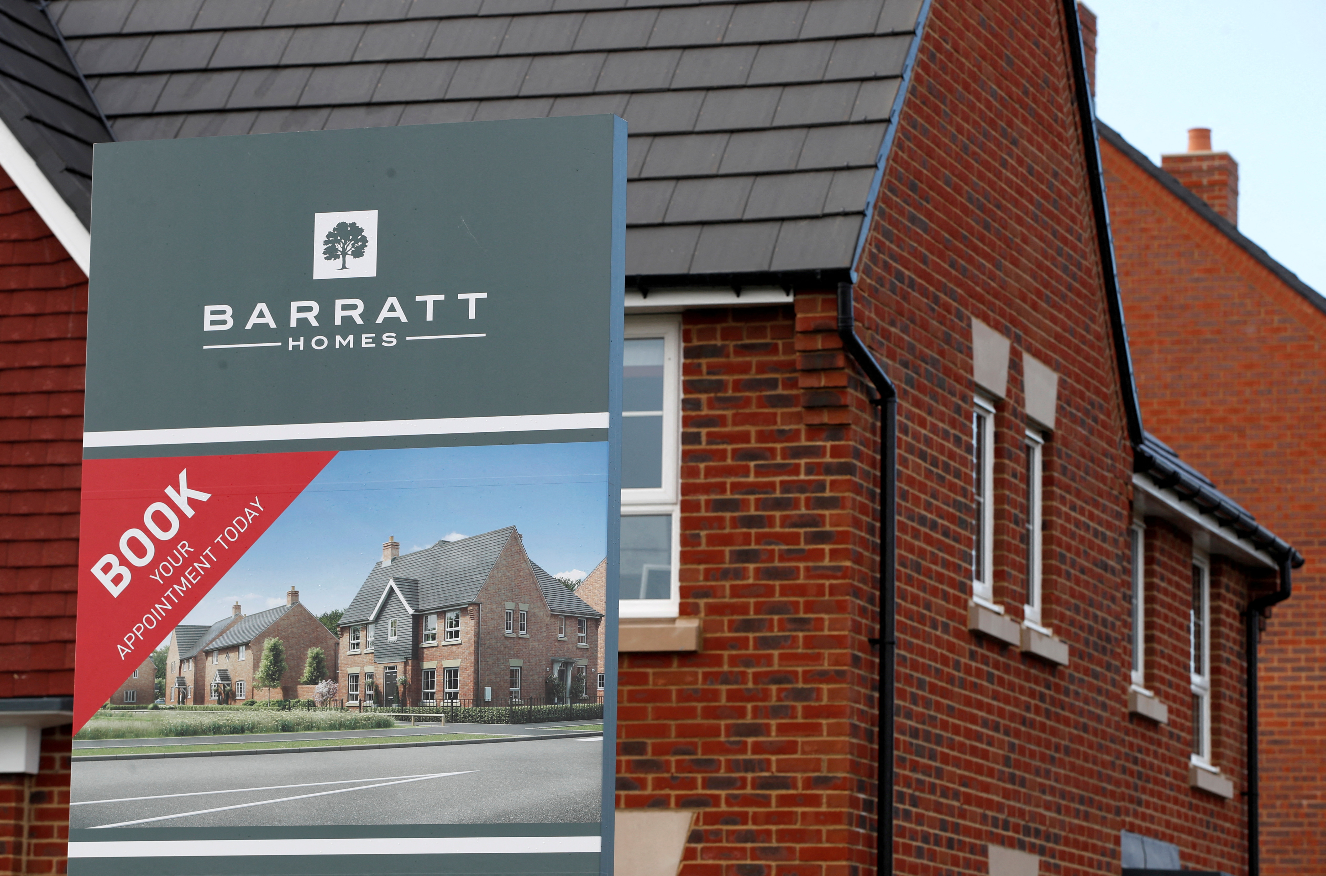 An advertising board of Britain's largest homebuilder Barratt Developments is pictured in Aylesbury