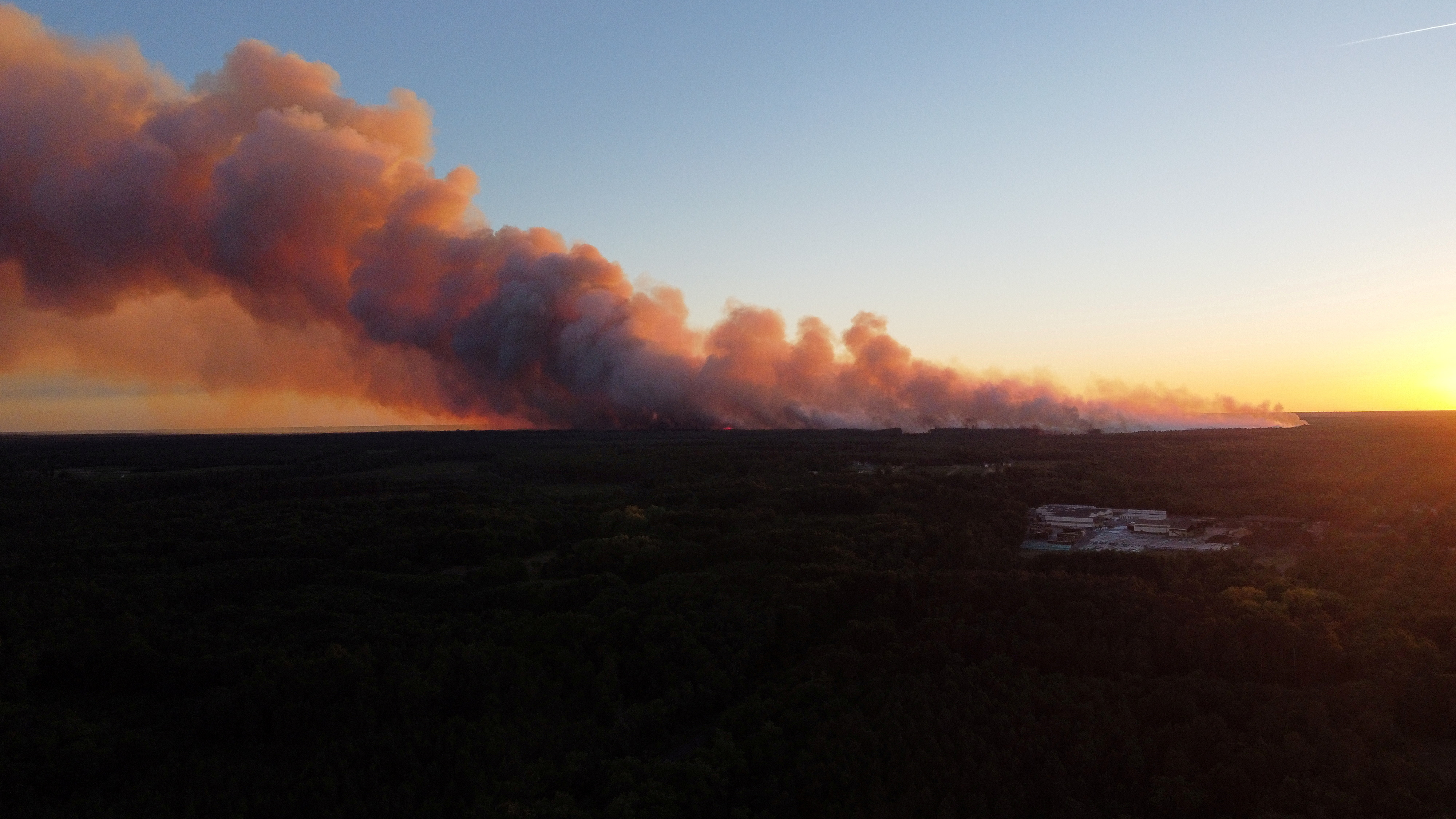 A view shows smoke rising from the Gironde forest fires as seen from Landiras