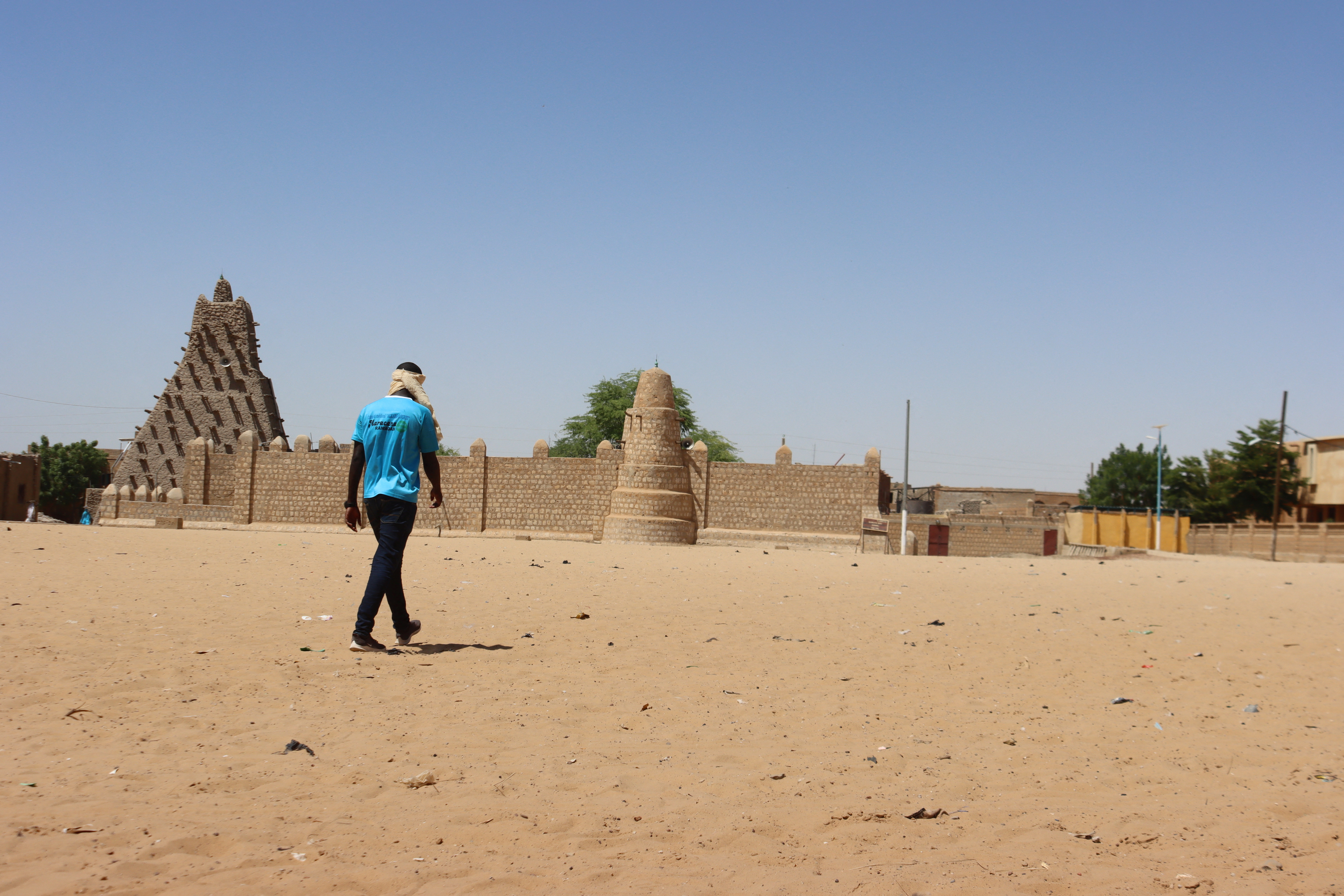 A man walks toward Sankore mosque, also known as the former University of Sankore, in Timbuktu