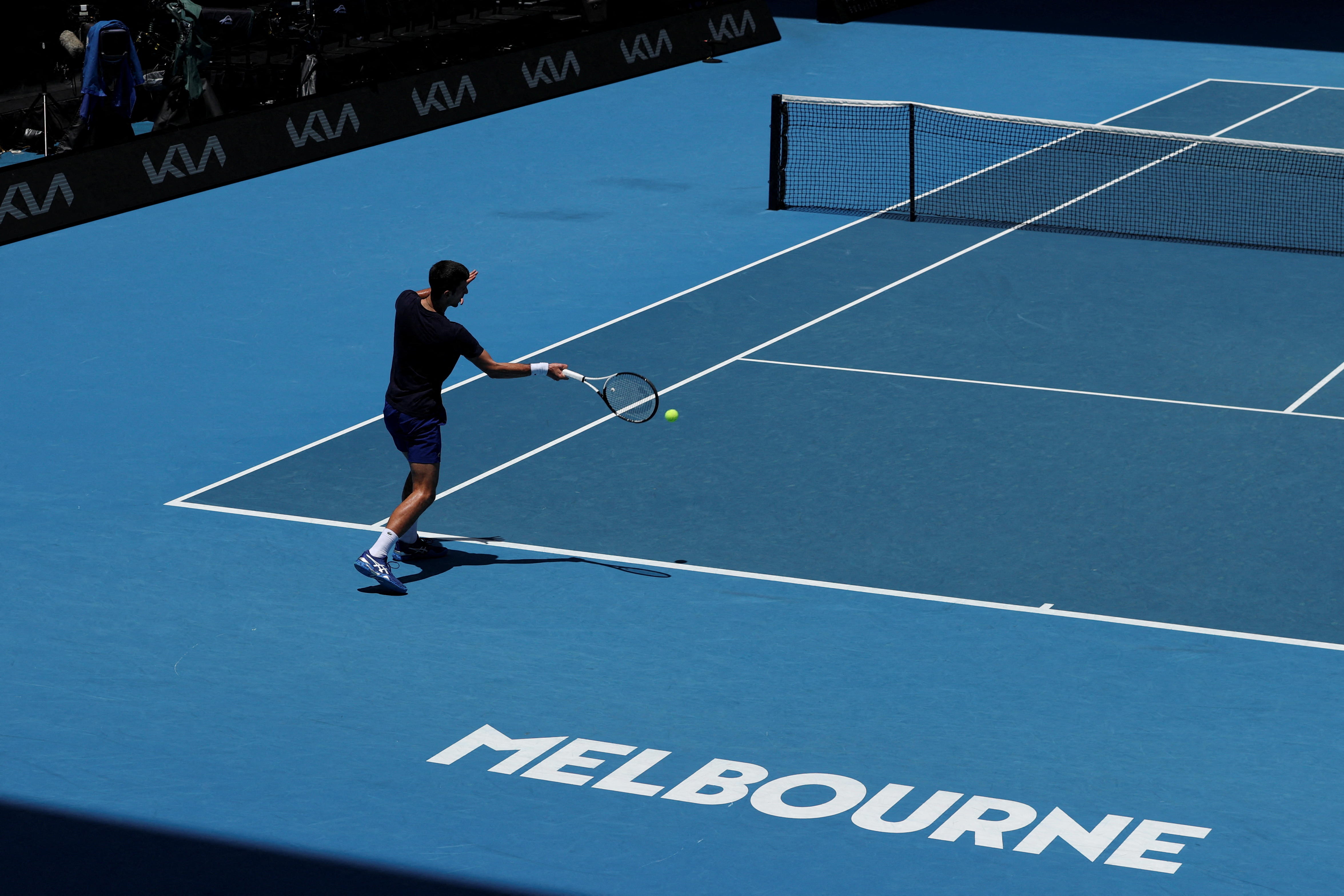 Serbian tennis player Novak Djokovic practices at Melbourne Park as questions remain over the legal battle regarding his visa to play in the Australian Open