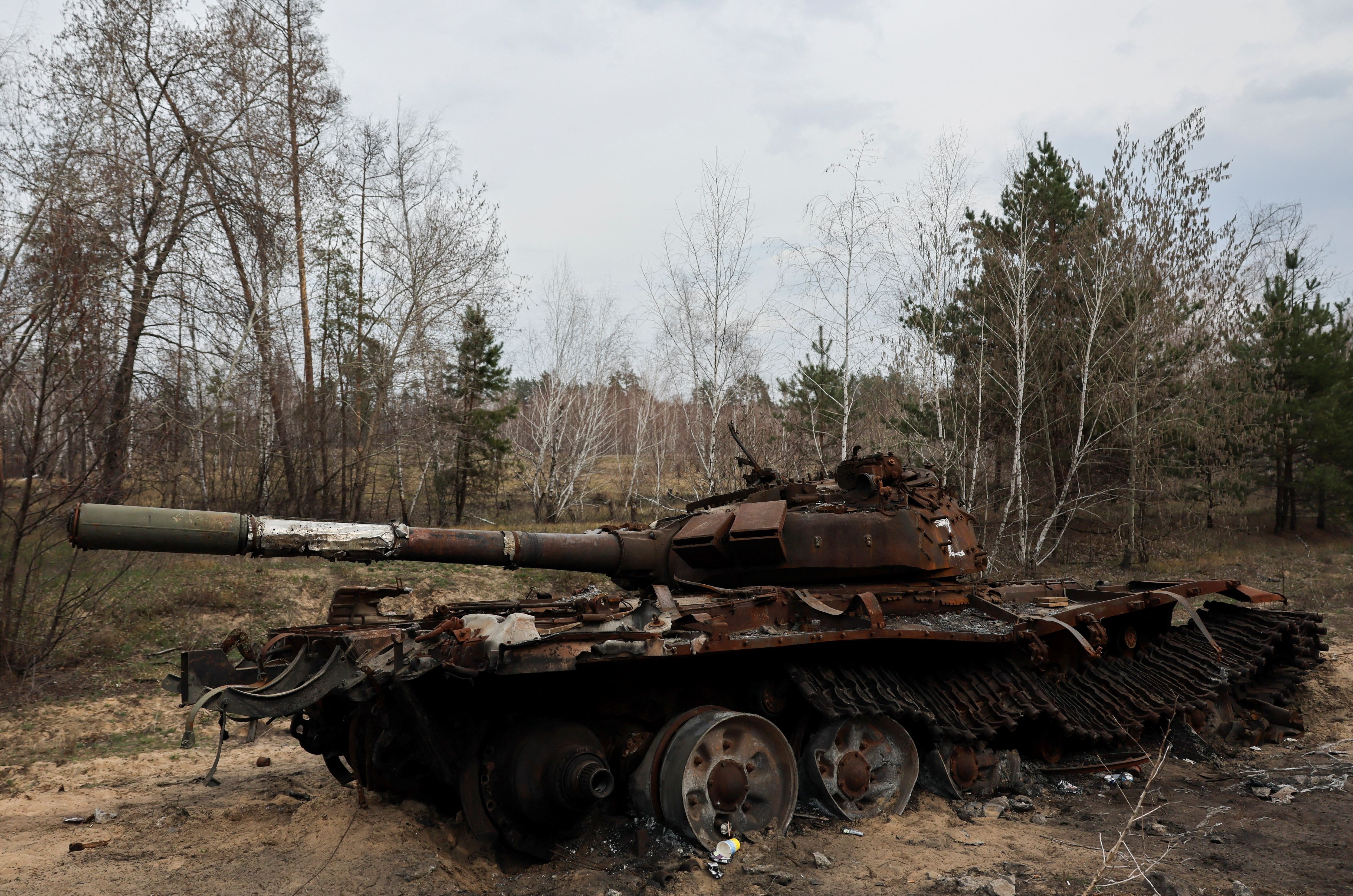 Destroyed Russian tank remains on the side of the road near the frontline town of Kreminna