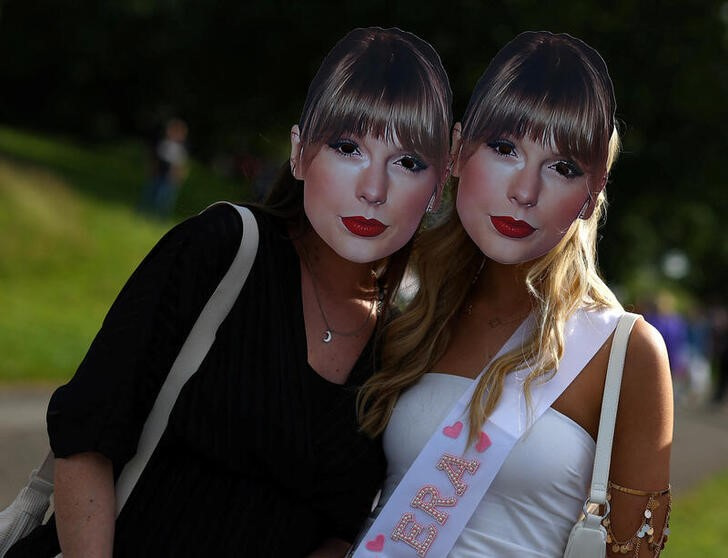 Taylor Swift fans arrive ahead of her concert at Anfield Stadium, in Liverpool