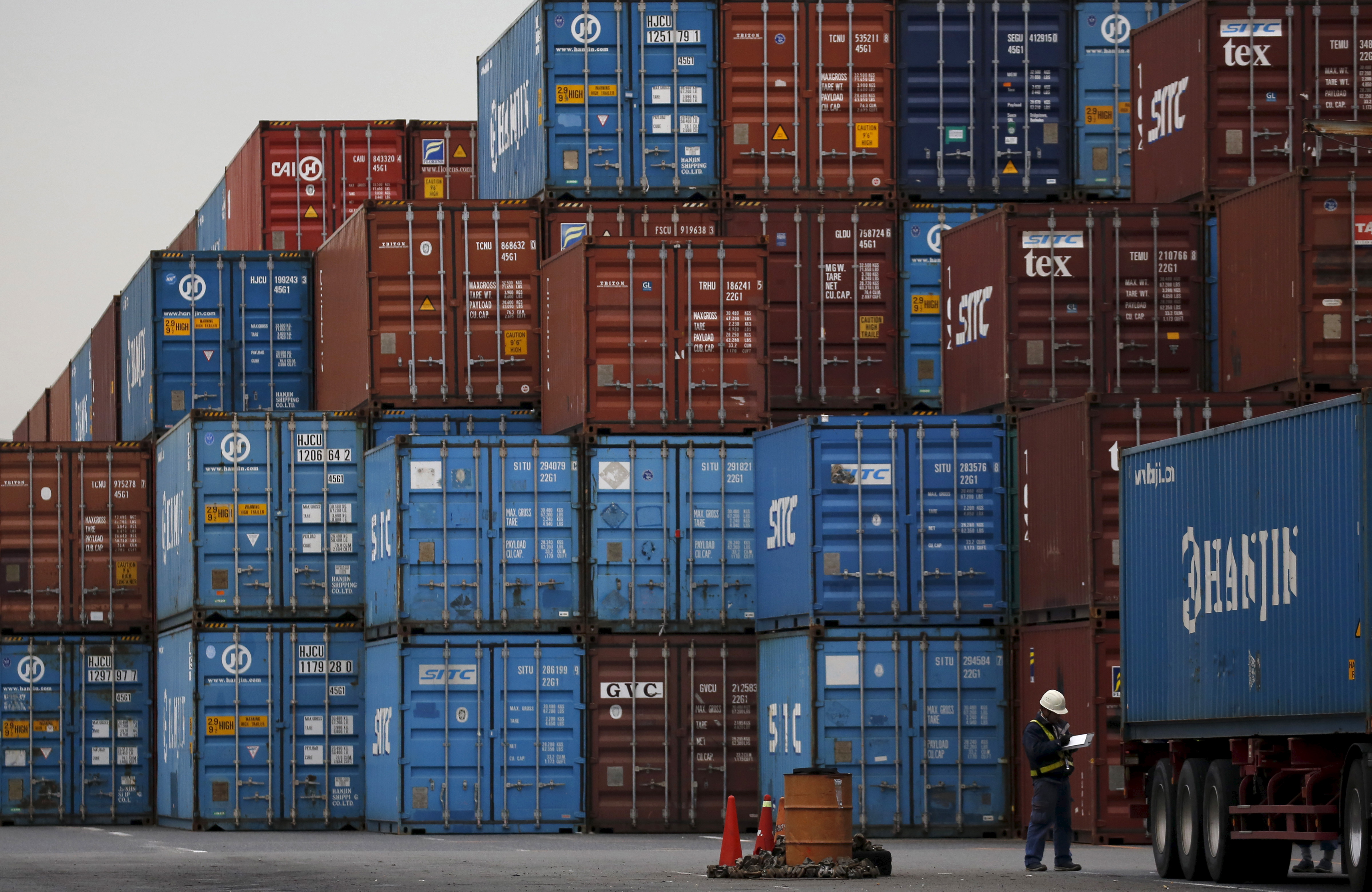 A laborer works in a container area at a port in Tokyo