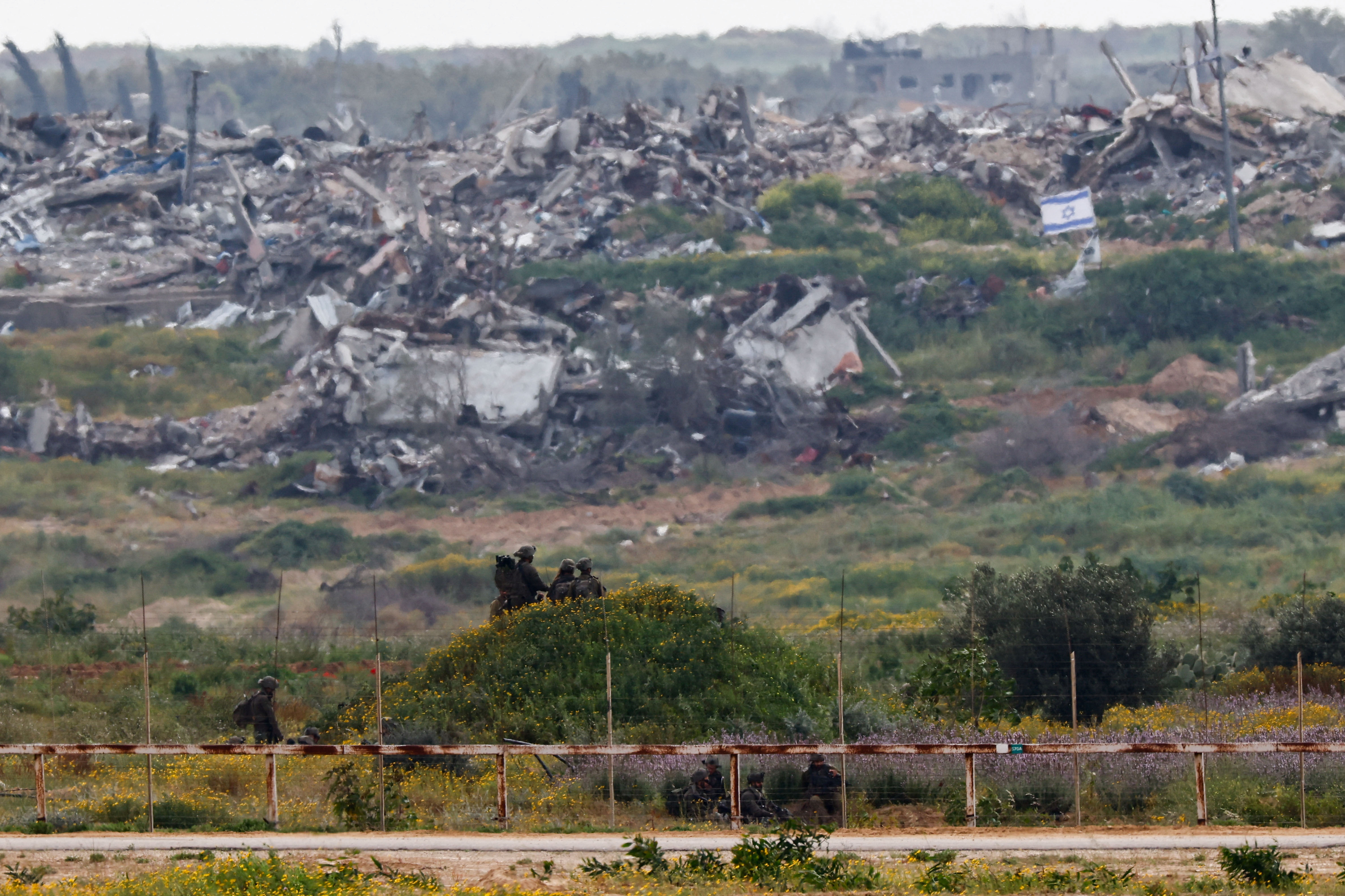 Israeli soldiers operate inside Gaza, as seen from southern Israel