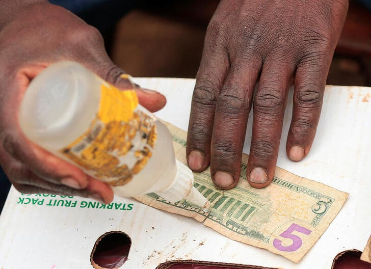 Worn-out U.S. banknotes repaired and sold in Zimbabwe