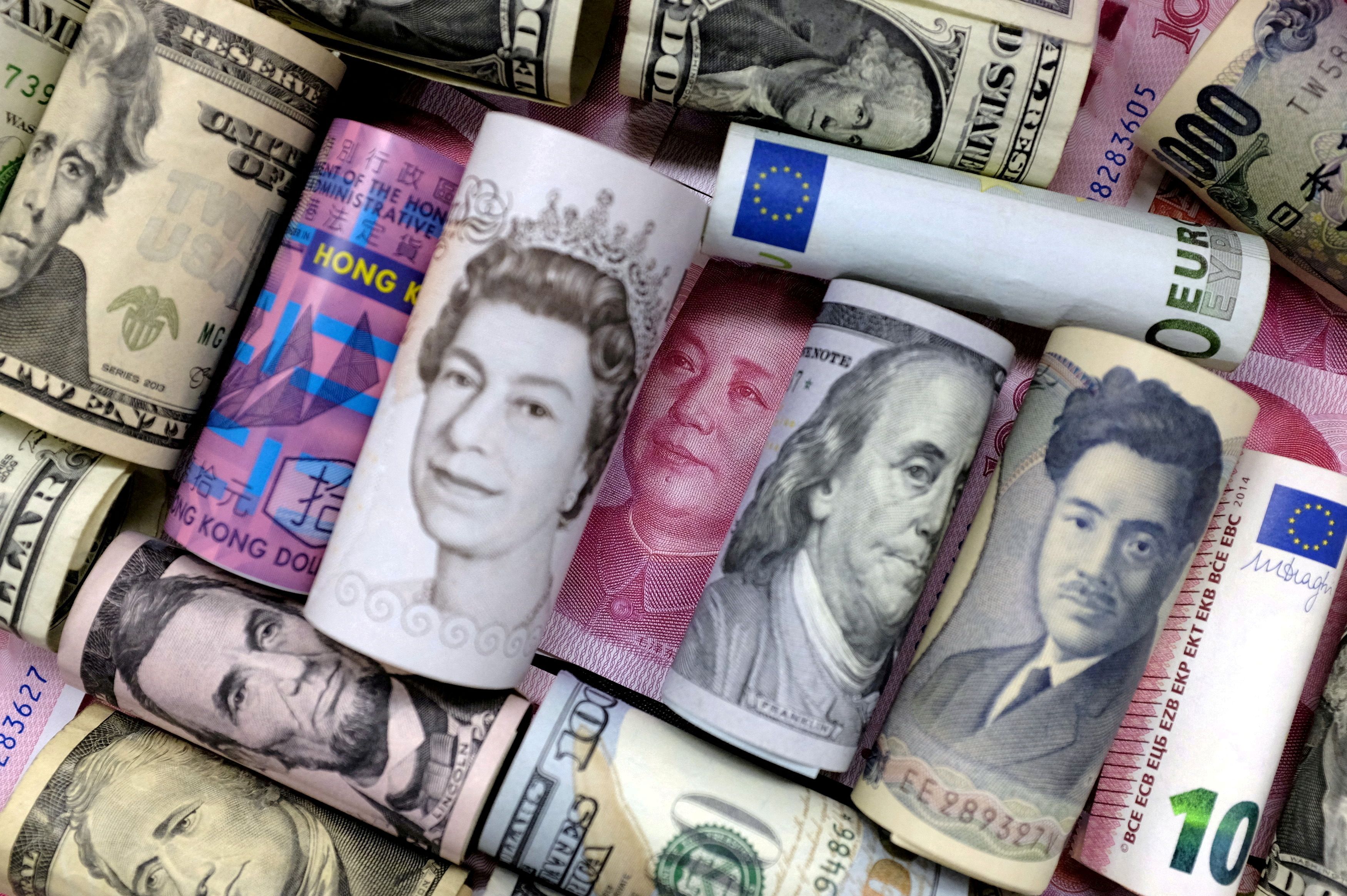 Euro, Hong Kong dollar, U.S. dollar, Japanese yen, pound and Chinese 100 yuan banknotes are seen in this picture illustration