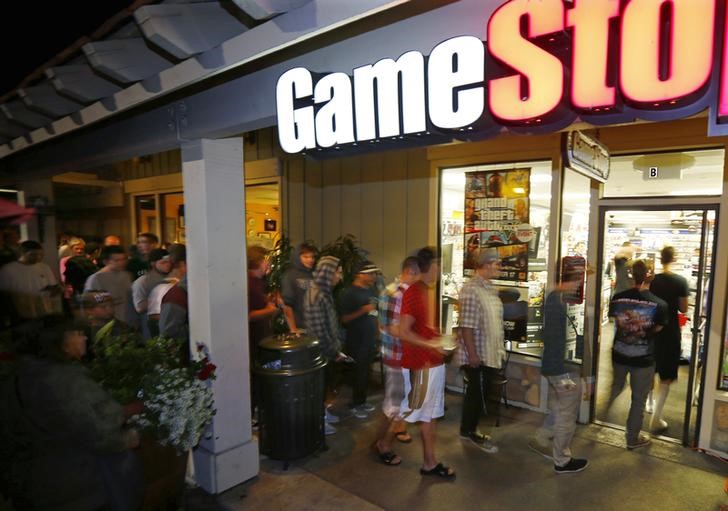 Game enthusiasts wait at a local Game Stop in Encinitas, California, September 17, 2013.