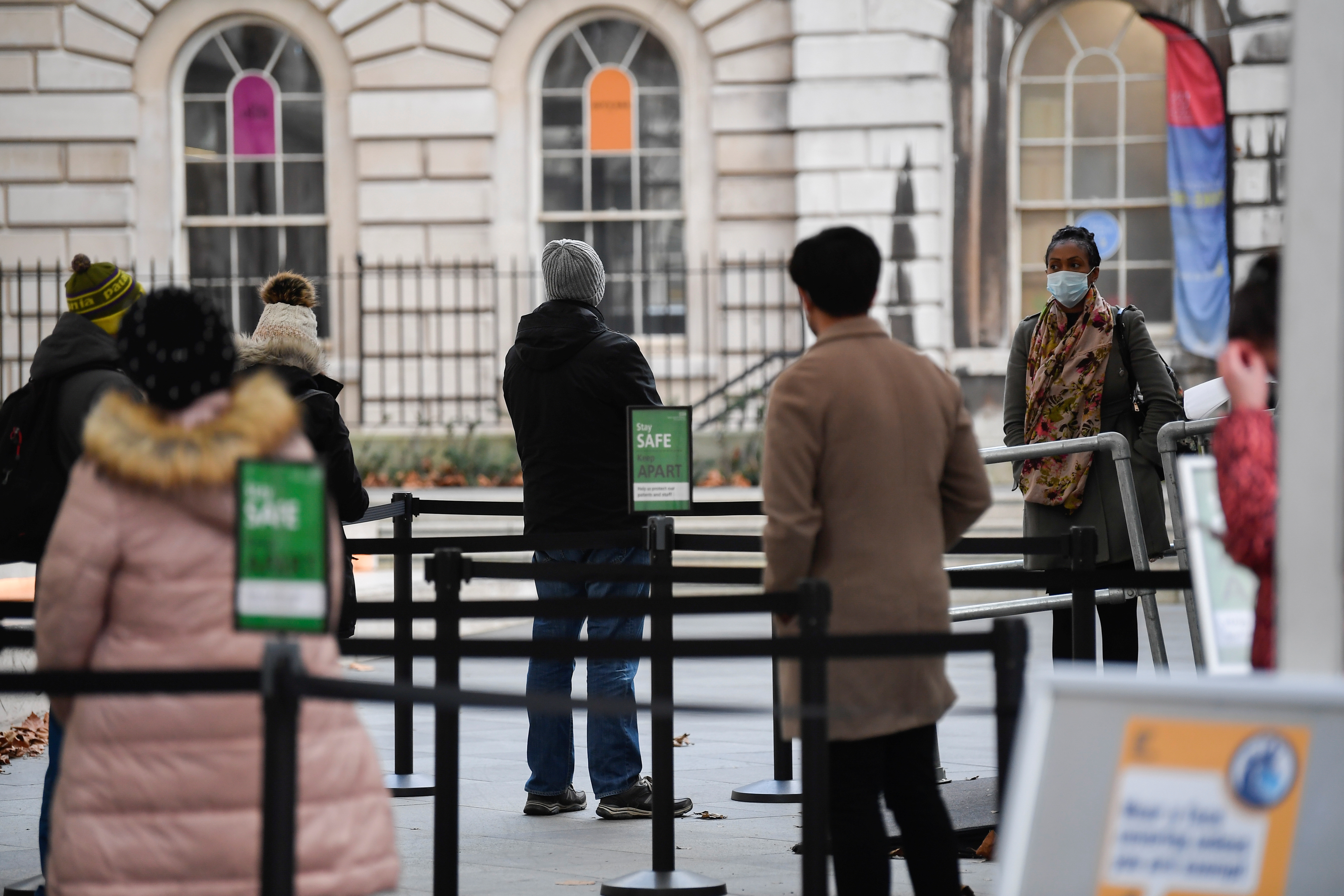 People queue as they wait to receive a COVID-19 vaccine at London Bridge vaccination centre, amidst the spread of the coronavirus disease (COVID-19), in London