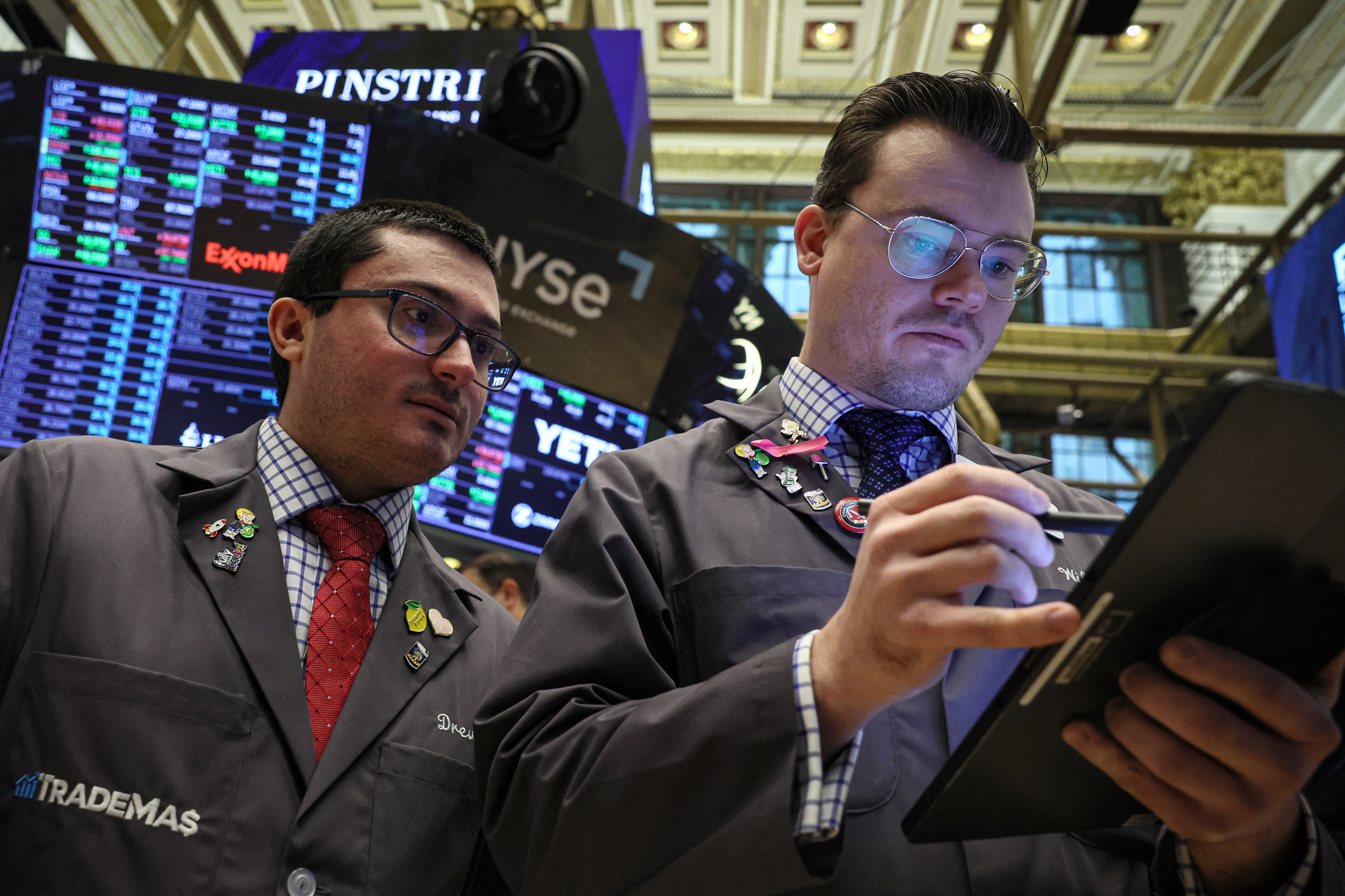 Traders work on the floor of the NYSE in New York