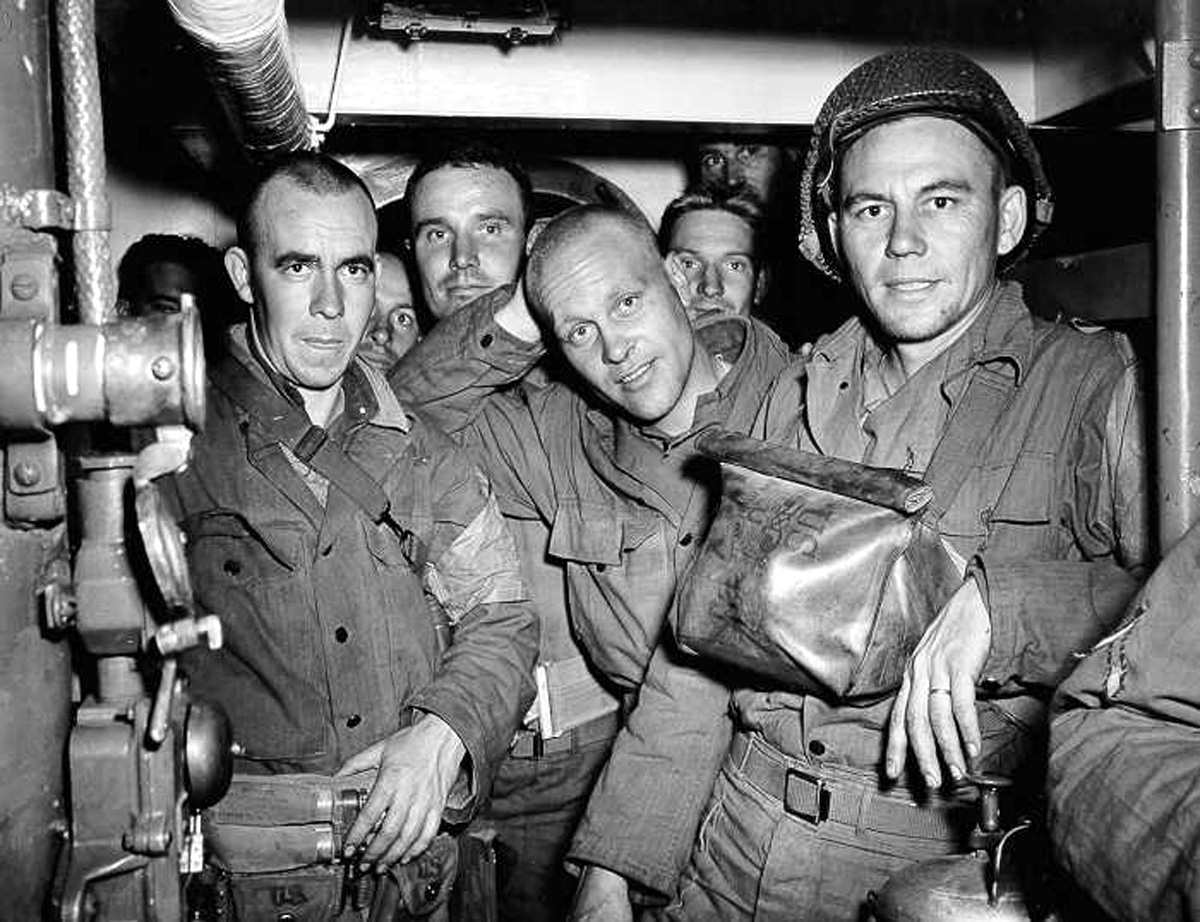 '- HANDOUT FILE PHOTO TAKEN 05JUN1944 - Bound for Normandy U.S. Army troops are seen on board a Coast..