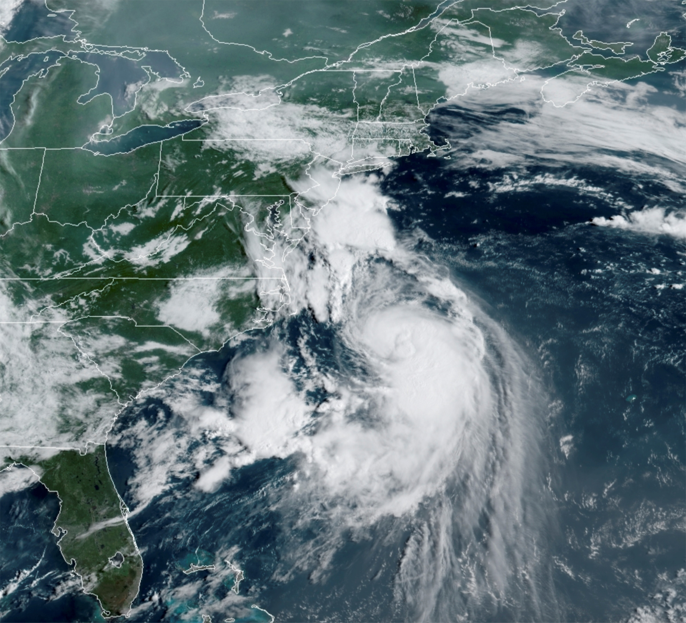 A satellite image shows Tropical Storm Henri over the Atlantic Ocean and approaching the east coast of the United States August 21, 2021.  NOAA/Handout via REUTERS 