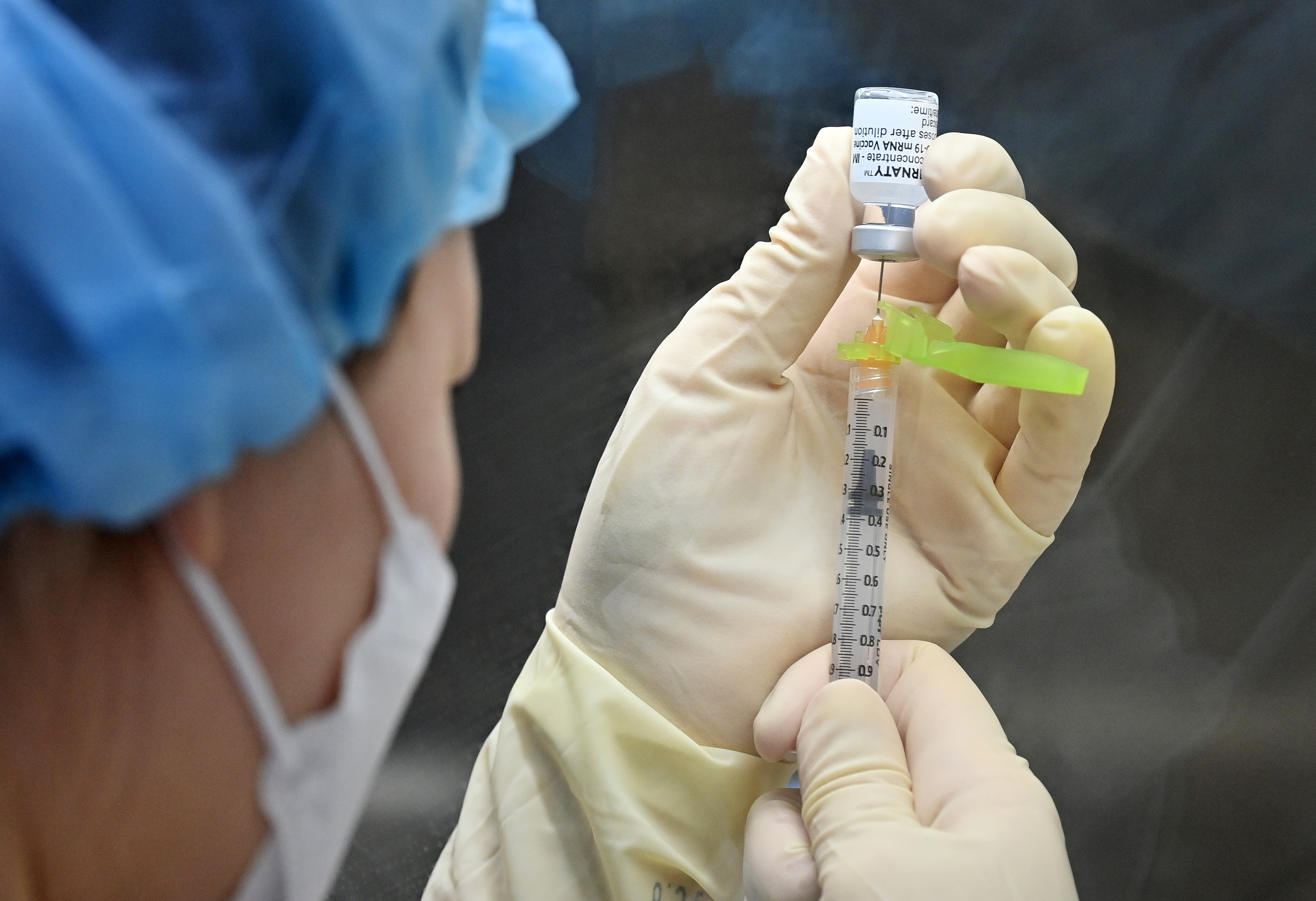 A nurse fills a syringe with the Pfizer-BioNTech coronavirus disease (COVID-19) vaccine at a vaccination centre in Seoul, South Korea