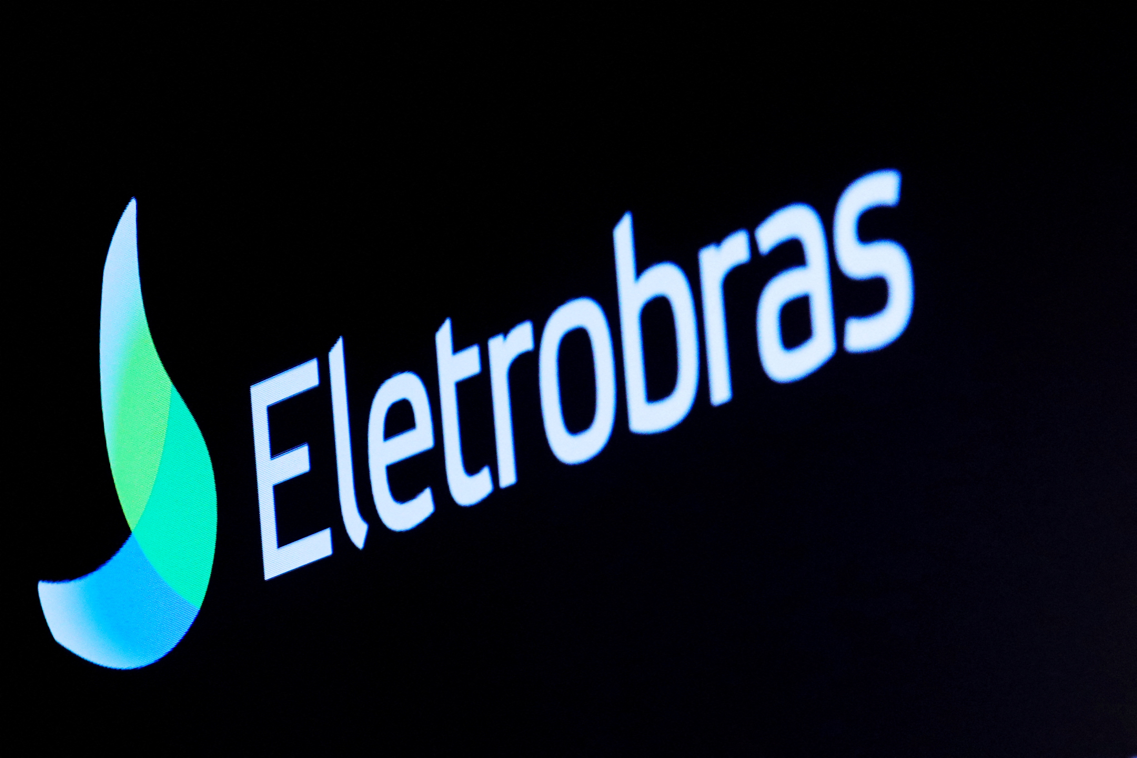 The logo for Eletrobras, a Brazilian electric utilities company, is displayed on a screen on the floor at the NYSE in New York