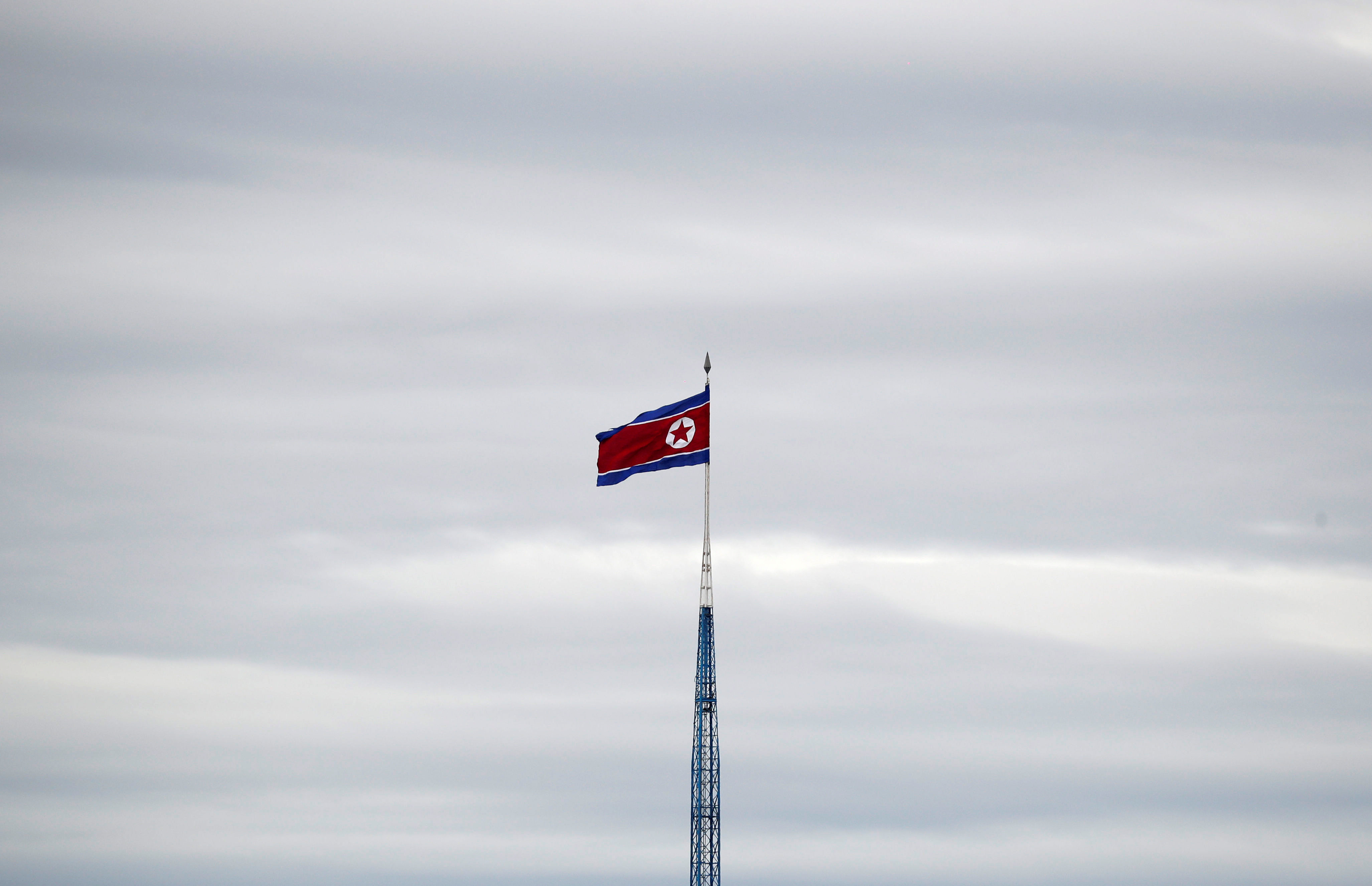 A North Korean flag flutters on top of a 160-metre tower in North Korea's propaganda village of Gijungdong, in this picture taken from the Tae Sung freedom village near the Military Demarcation Line (MDL), in Paju