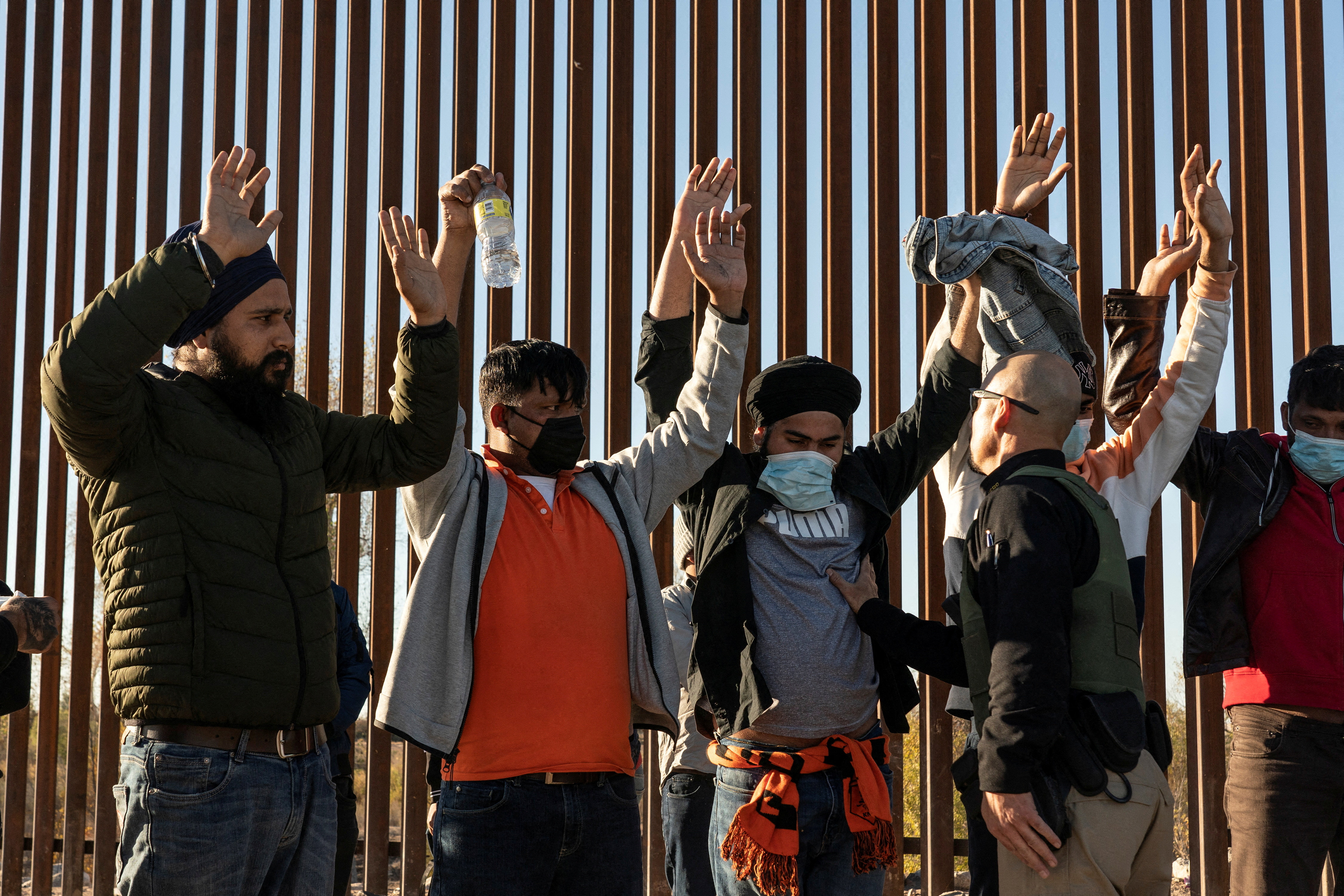Migrants cross the border in Yuma, Arizona