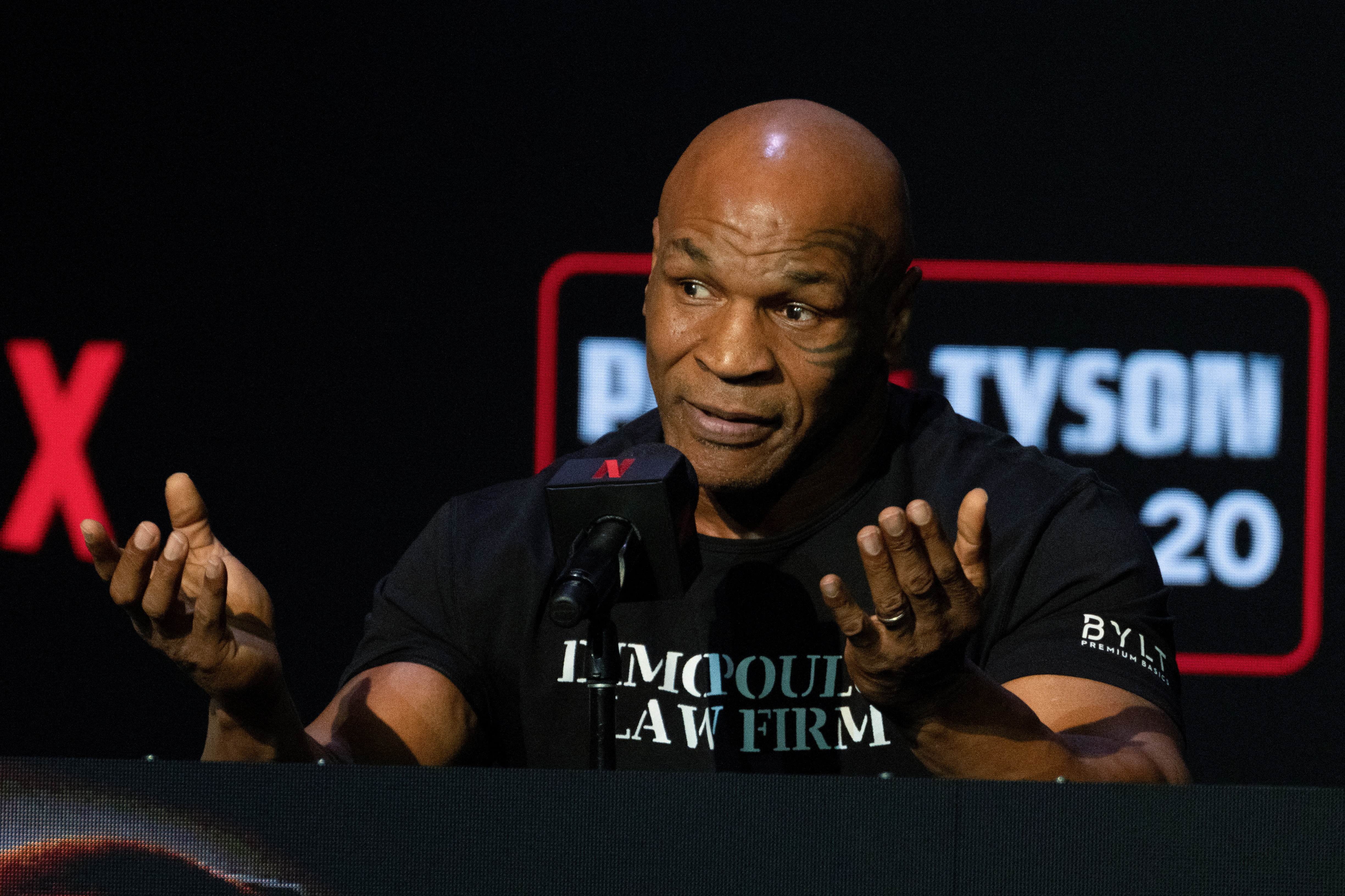 Boxers Mike Tyson and Jake Paul attend a news conference in New York