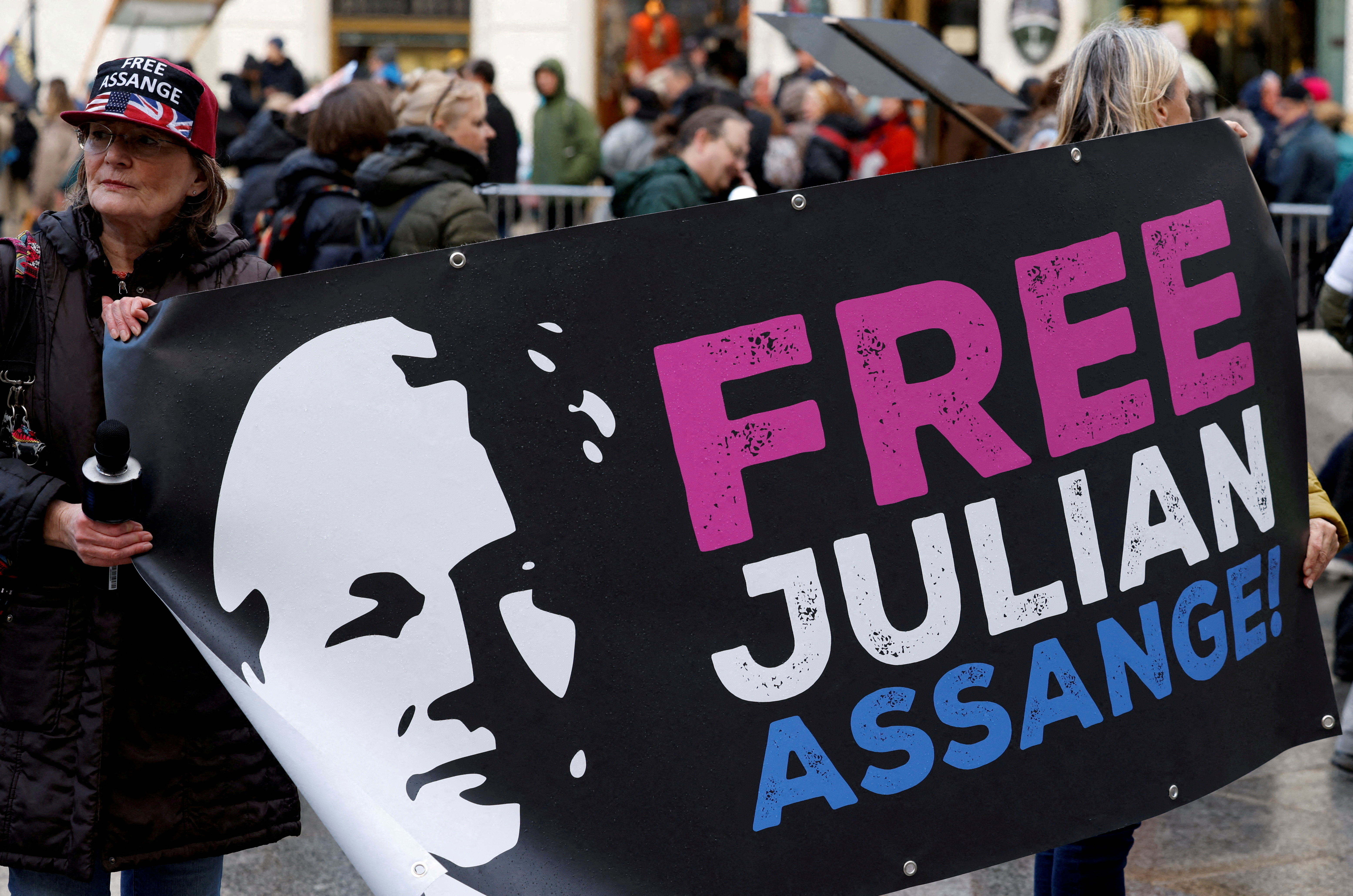 Supporters of WikiLeaks founder Julian Assange protest in Vienna