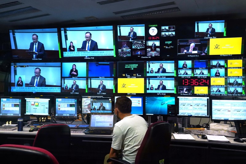 Live footage of the meeting to debate on electoral reform bill is seen on the screens inside a control room at Legislative Council in Hong Kong, China 26 May, 2021. REUTERS/Lam Yik