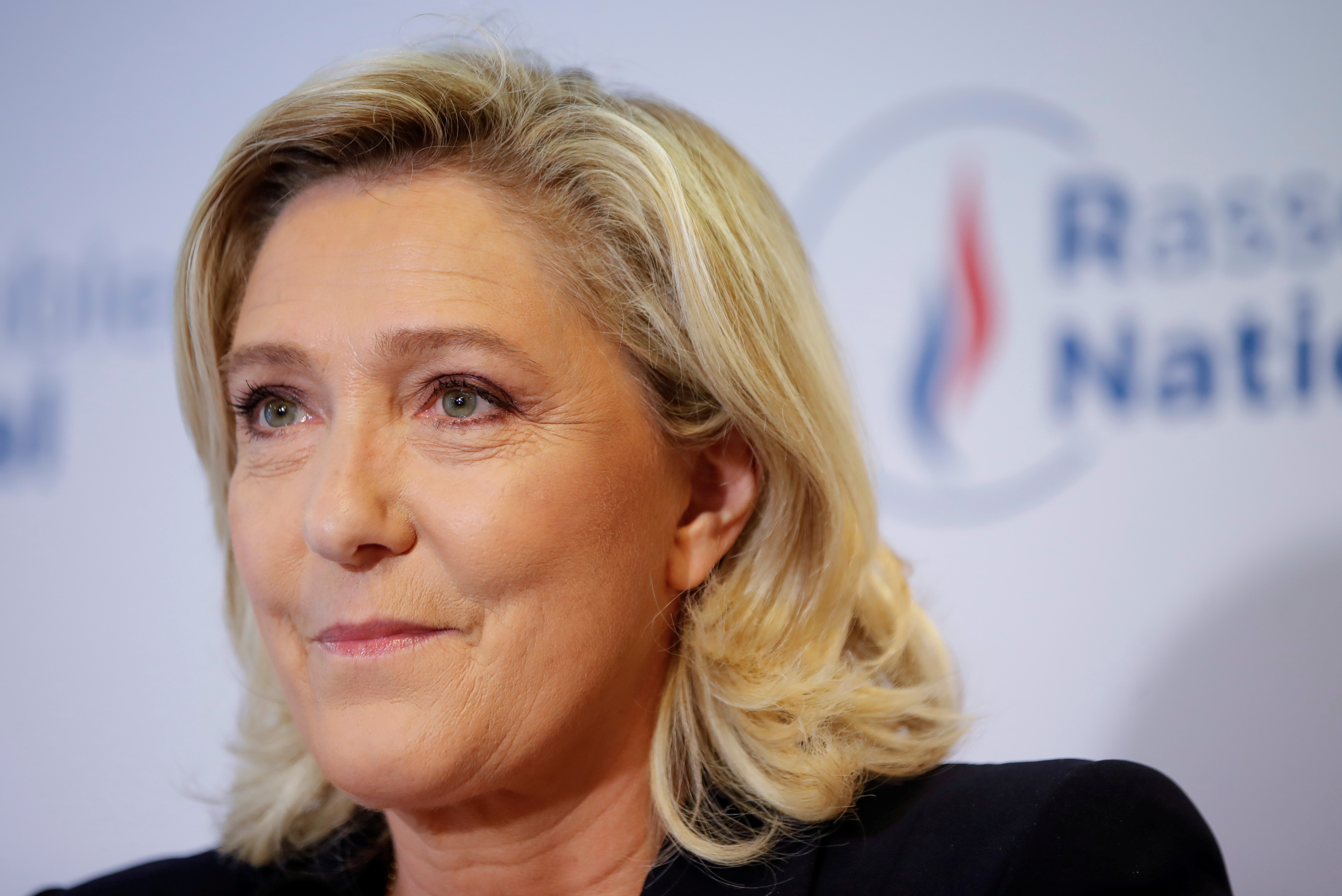French far right leader Marine Le Pen reacts to the results of regional election, in Nanterre