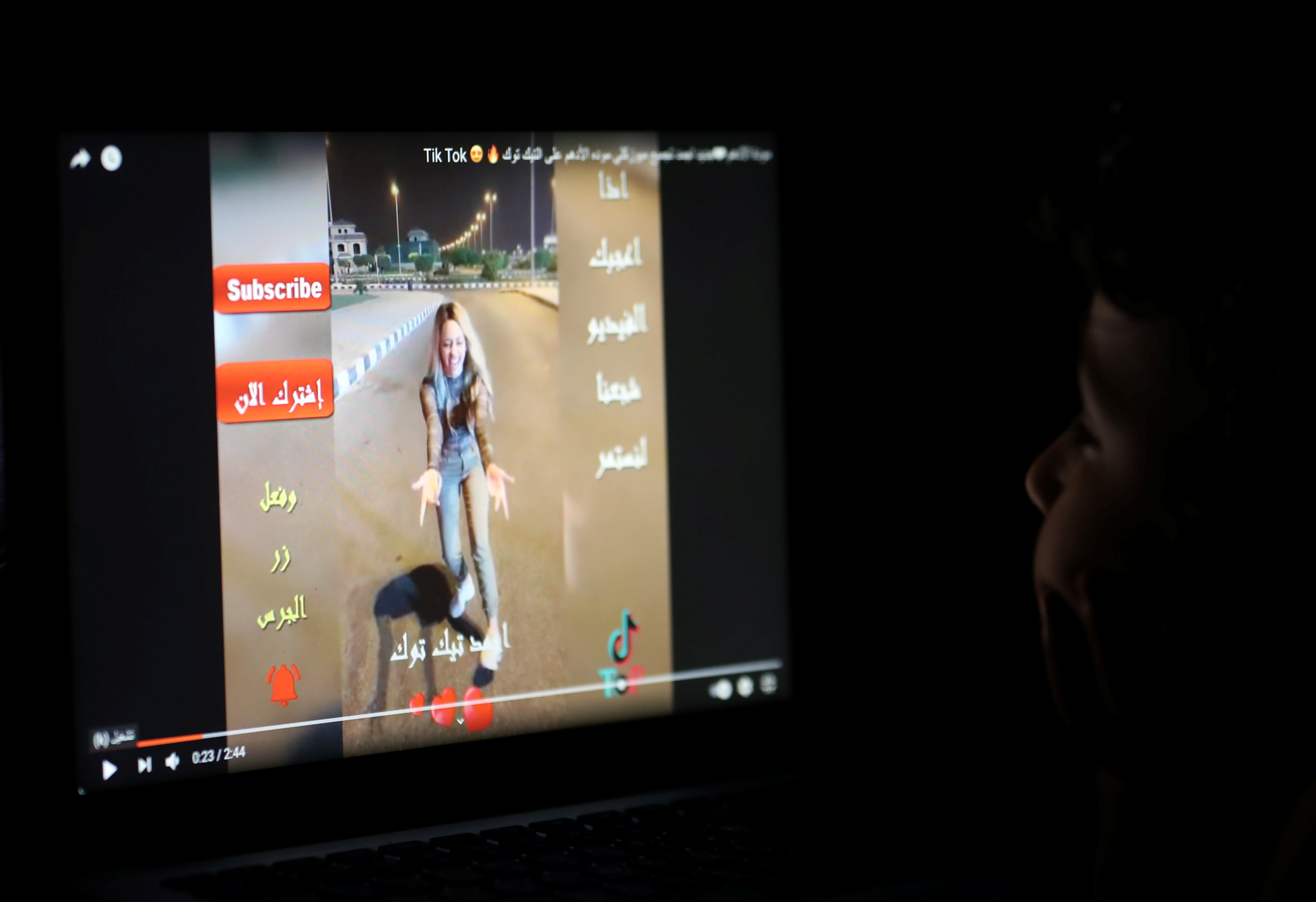 A child watches a video for Tik Tok influencer Mawada al-Adham in her home in Cairo