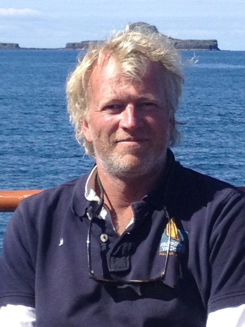 Dutch boat captain Ernst-Jan de Groot, poses for a picture a few miles east of the Scottish  island of Bac Mor, also known as the Dutchman's Cap, in this handout photograph taken in July 2015. Charles Lyster/Ernst-Jan de Groot/Handout via REUTERS 