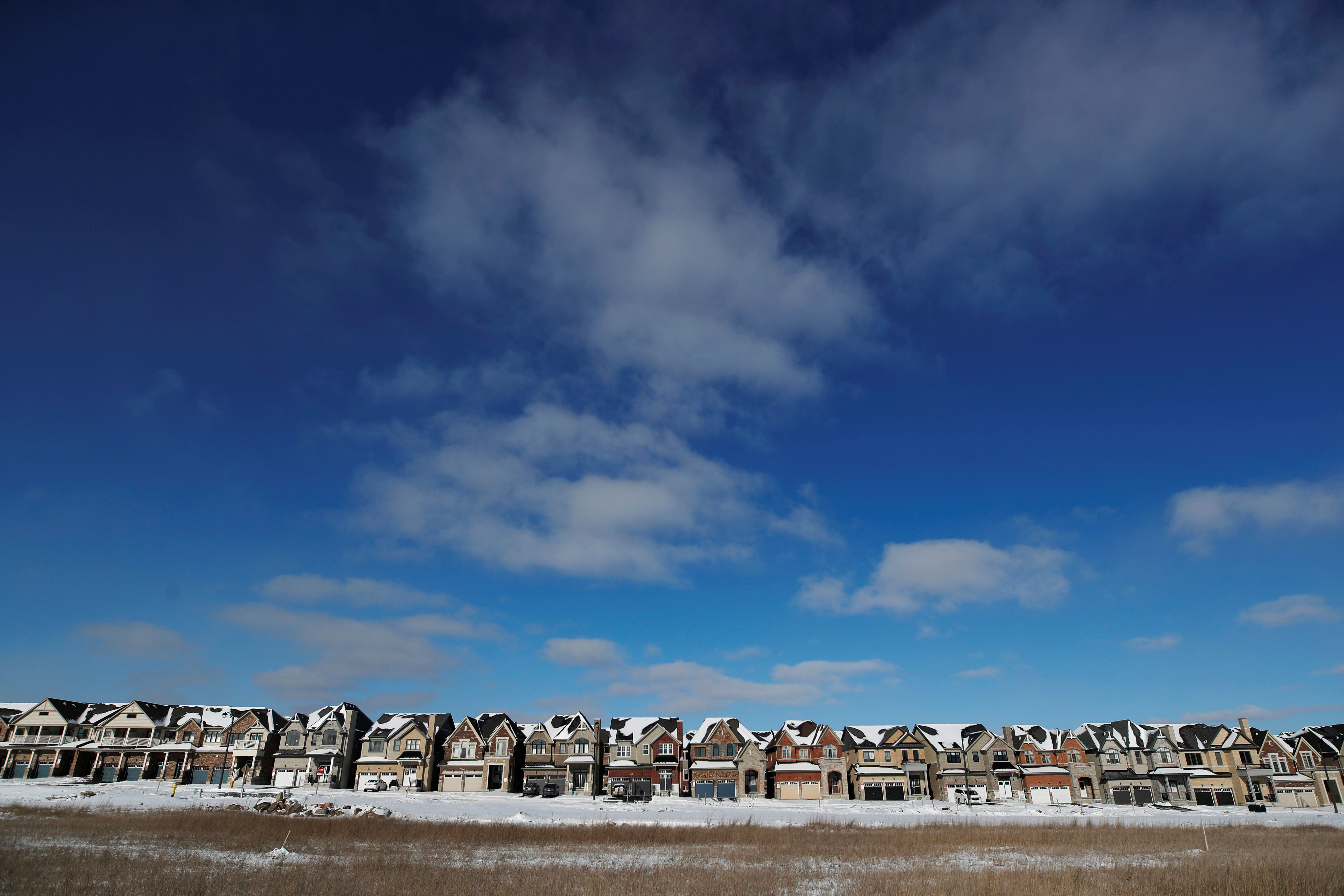 A row of houses stand in a newly built subdivision in East Gwillimbury