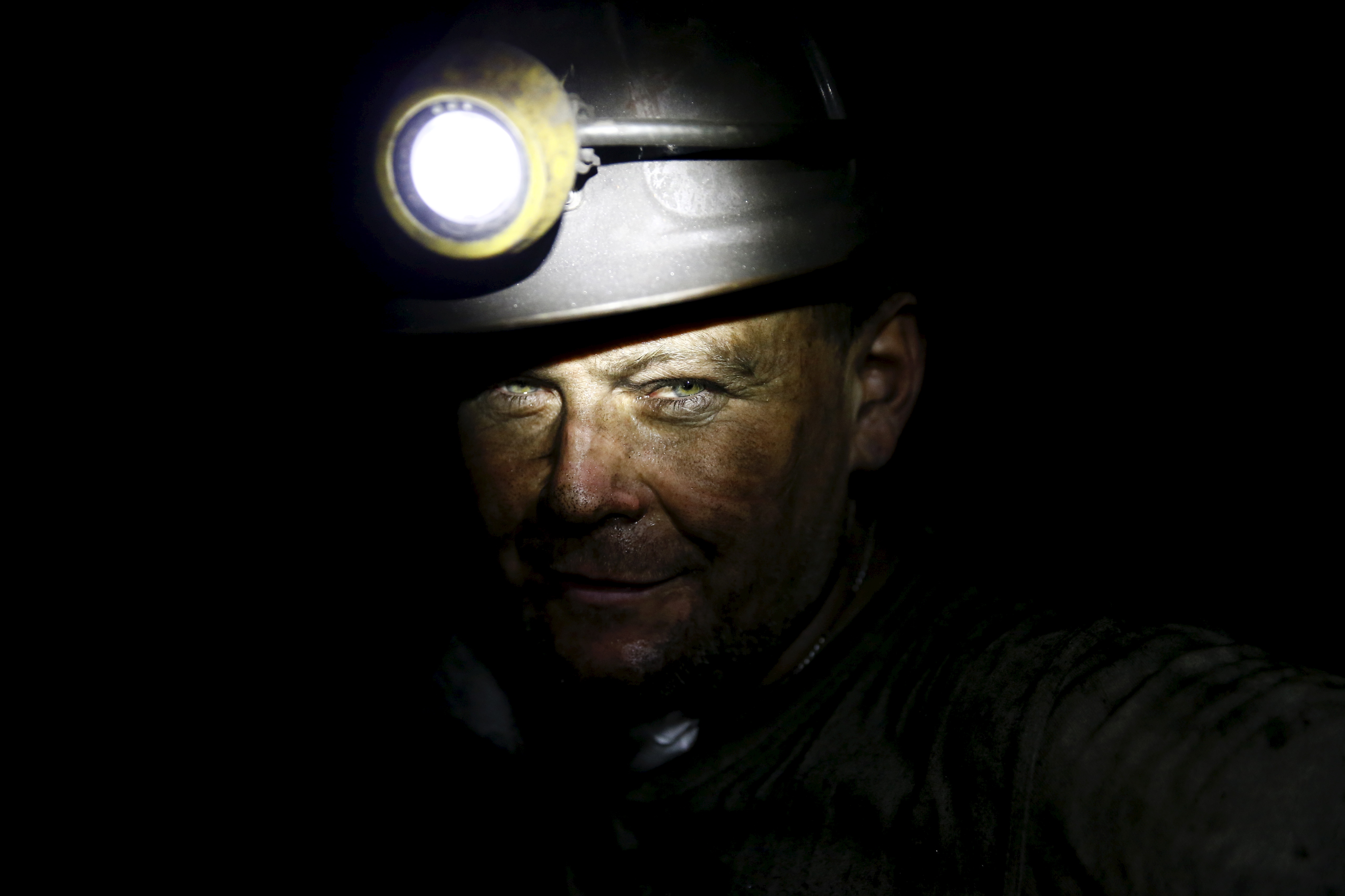 Piotr Dytko, 42, a miner who has has worked for 24 years in mines, looks on as he works about 500 meters underground at the Boleslaw Smialy coal mine, a unit of coal miner Kompania Weglowa (KW) in Laziska Gorne