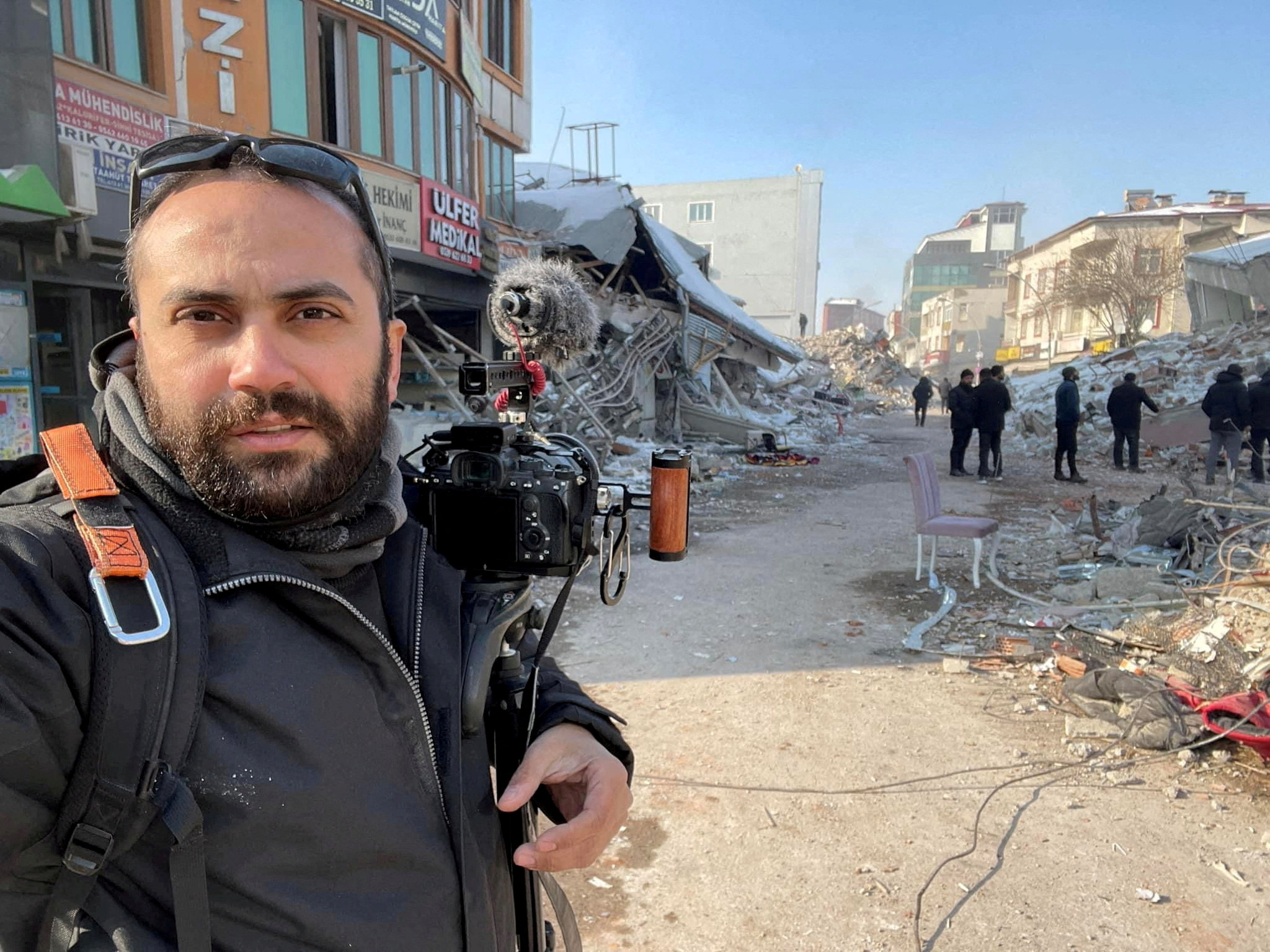 Reuters visuals journalist Issam Abdallah takes a selfie picture while working in Maras, Turkey