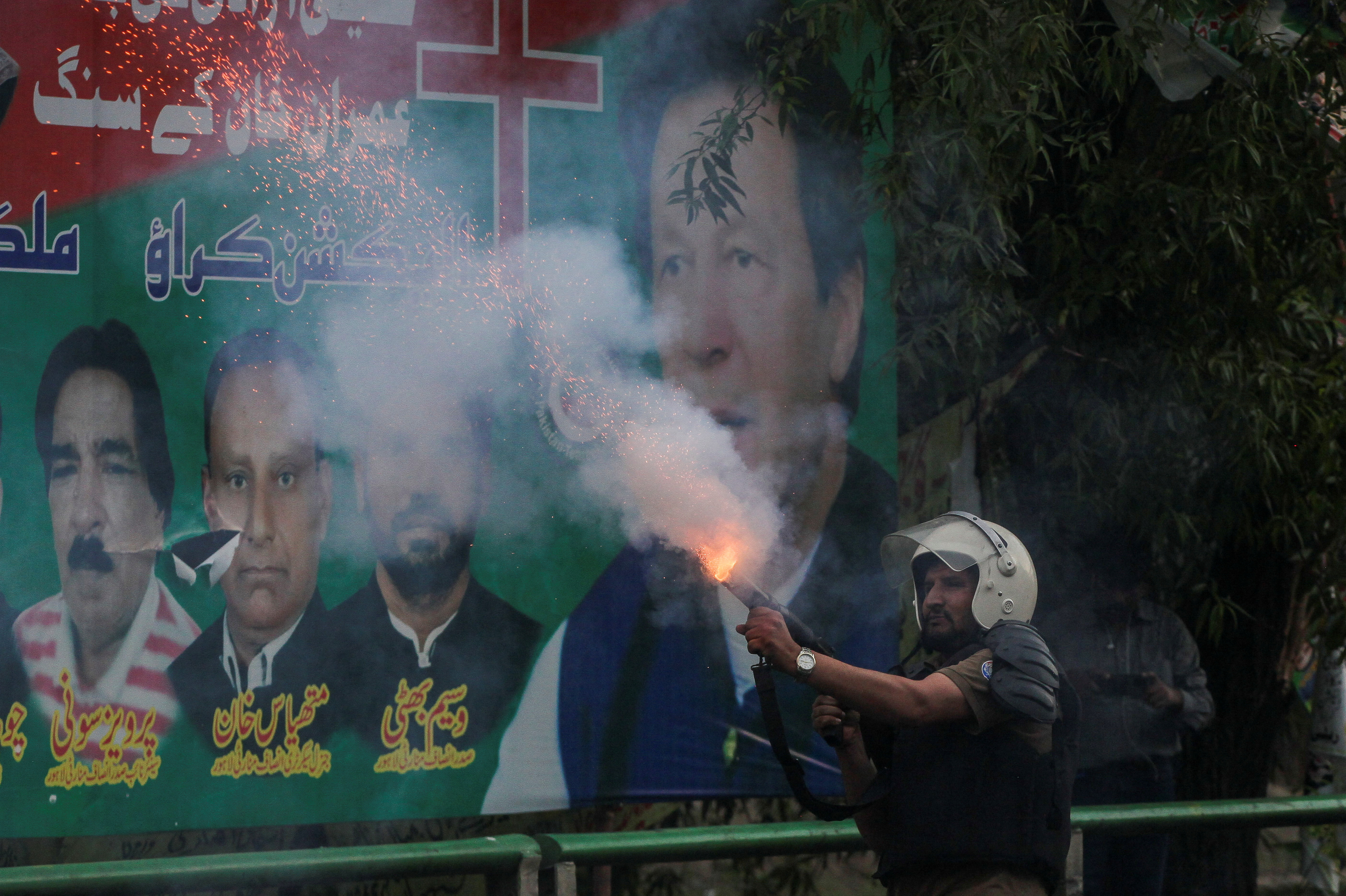 Supporters of former Pakistani PM Khan clash with police ahead of his possible arrest, in Lahore