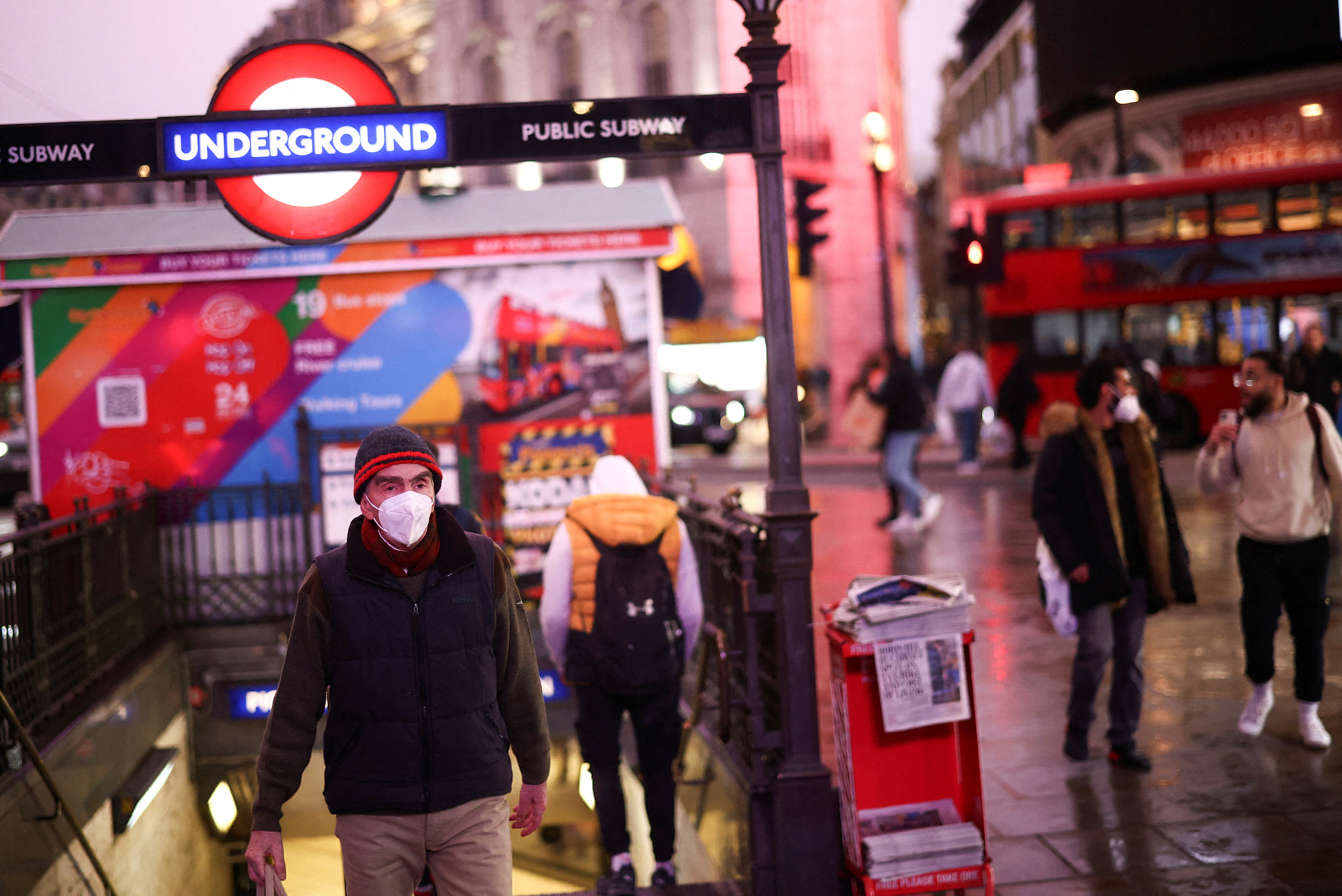People exit Piccadilly Circus underground station, amid the coronavirus disease (COVID-19) outbreak, in central London