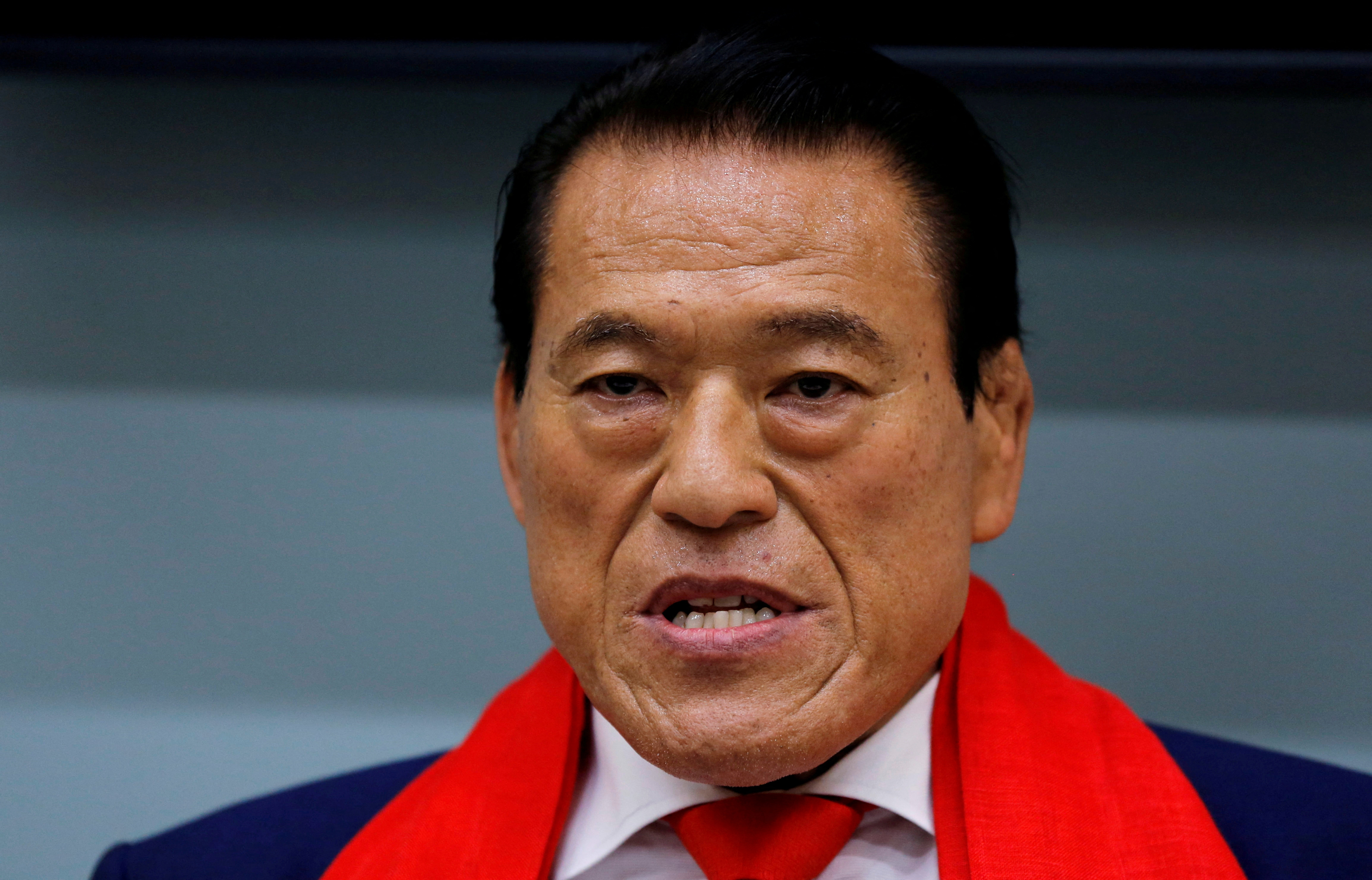 Japanese politician and former wrestling star Inoki attends a news conference after his visit to Pyongyang, as he arrives at Haneda international airport in Tokyo