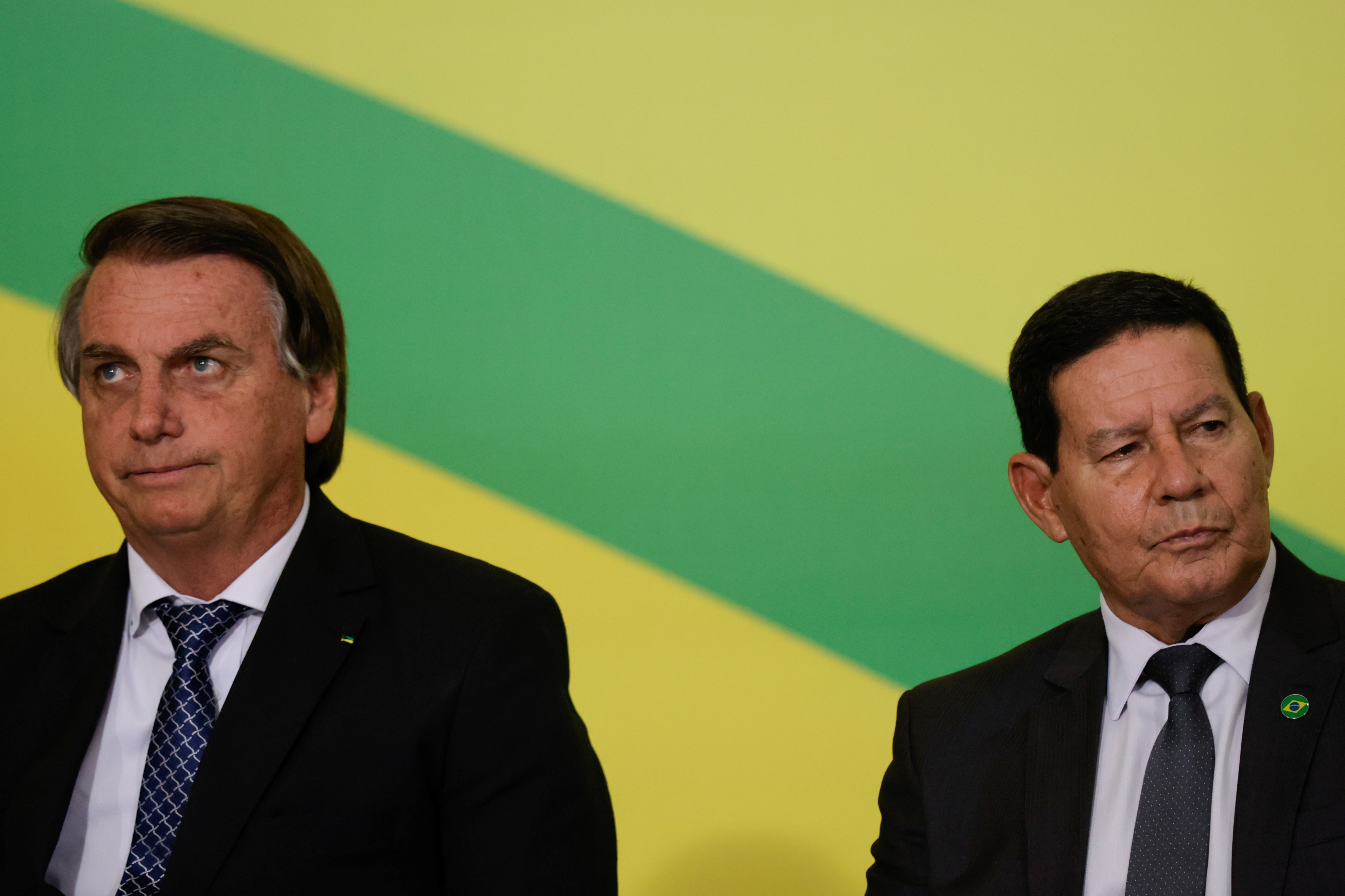 Brazil's President Jair Bolsonaro and Brazil's Vice President Hamilton Mourao attend a ceremony to consolidate the Infralegal Labor Regulatory Framework, in Brasilia