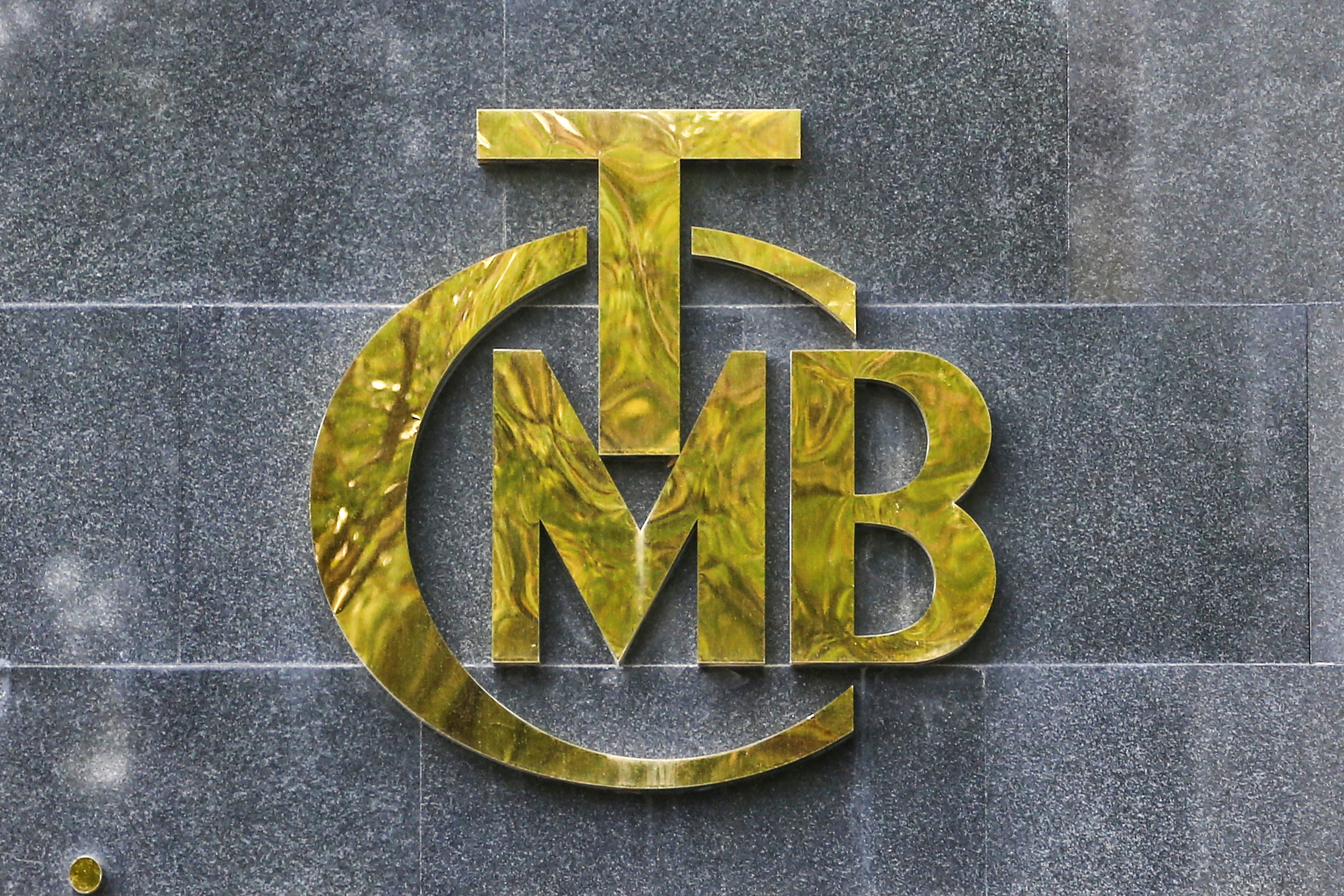 A logo of Turkey's Central Bank is pictured at the entrance of its headquarters in Ankara, Turkey October 15, 2021. REUTERS/Cagla Gurdogan