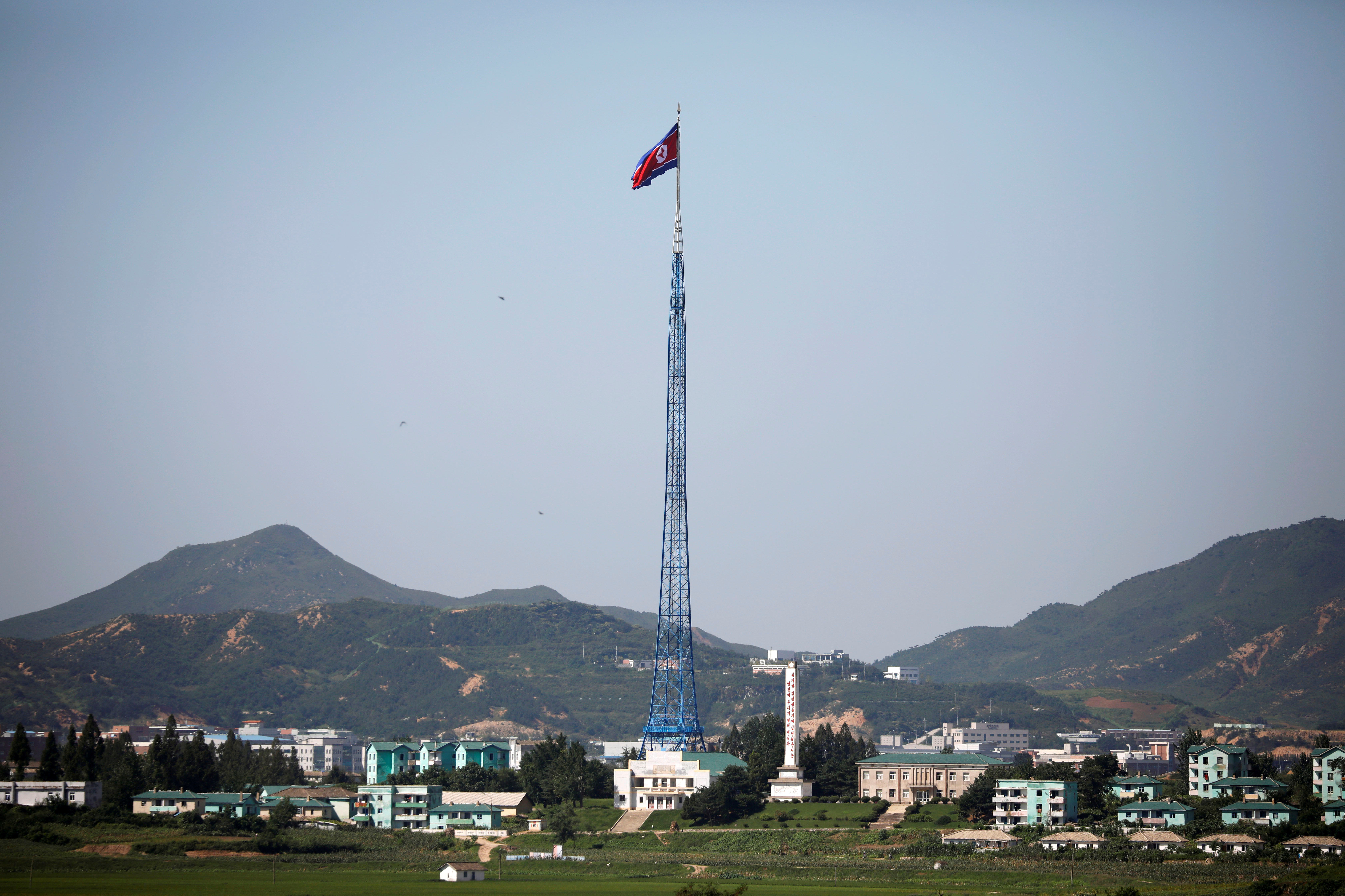 A North Korean flag flutters on top of a tower at the propaganda village of Gijungdong in North Korea, in this picture taken near the truce village of Panmunjom