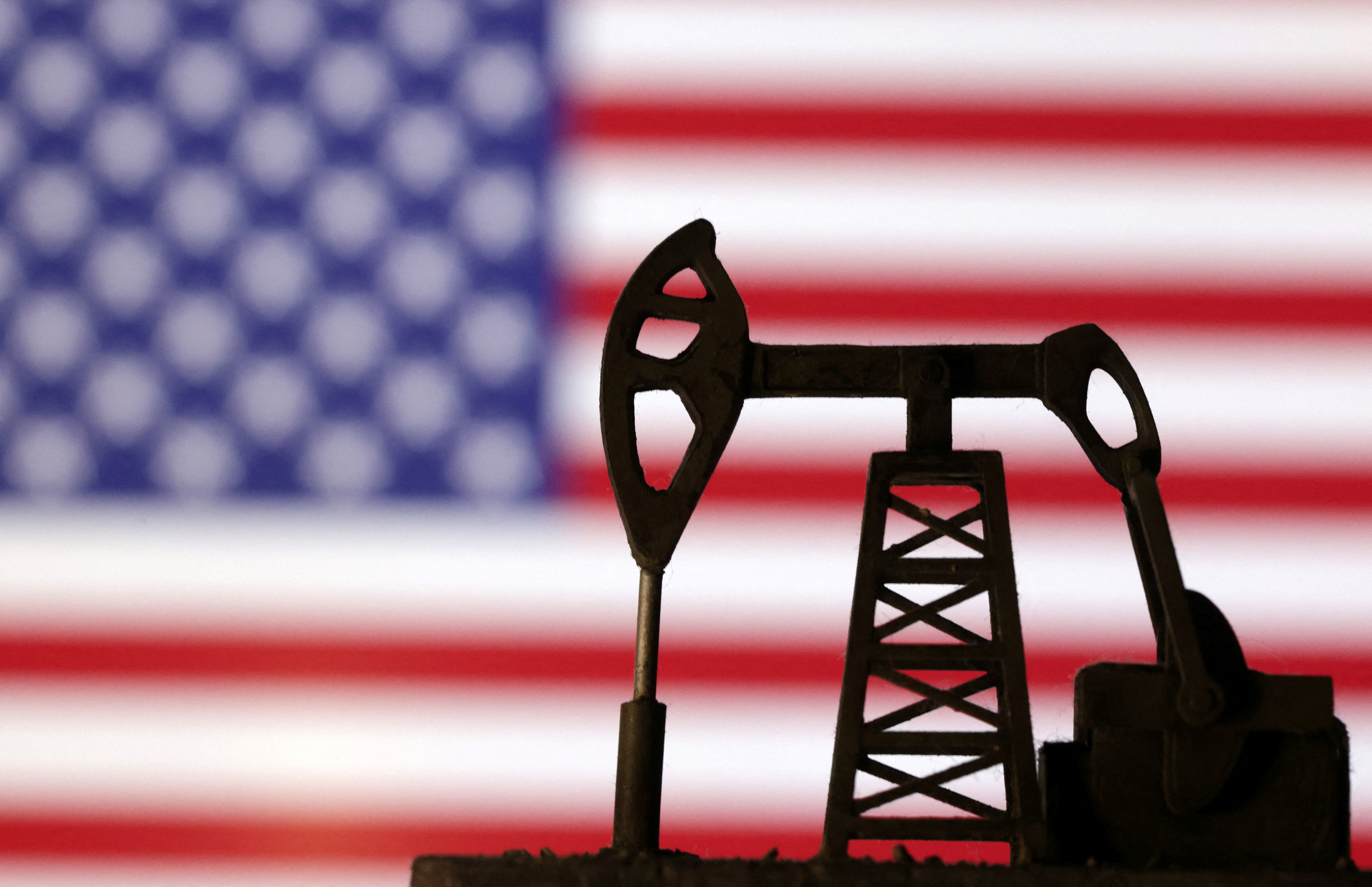 Illustration shows Oil pump jack and U.S. flag
