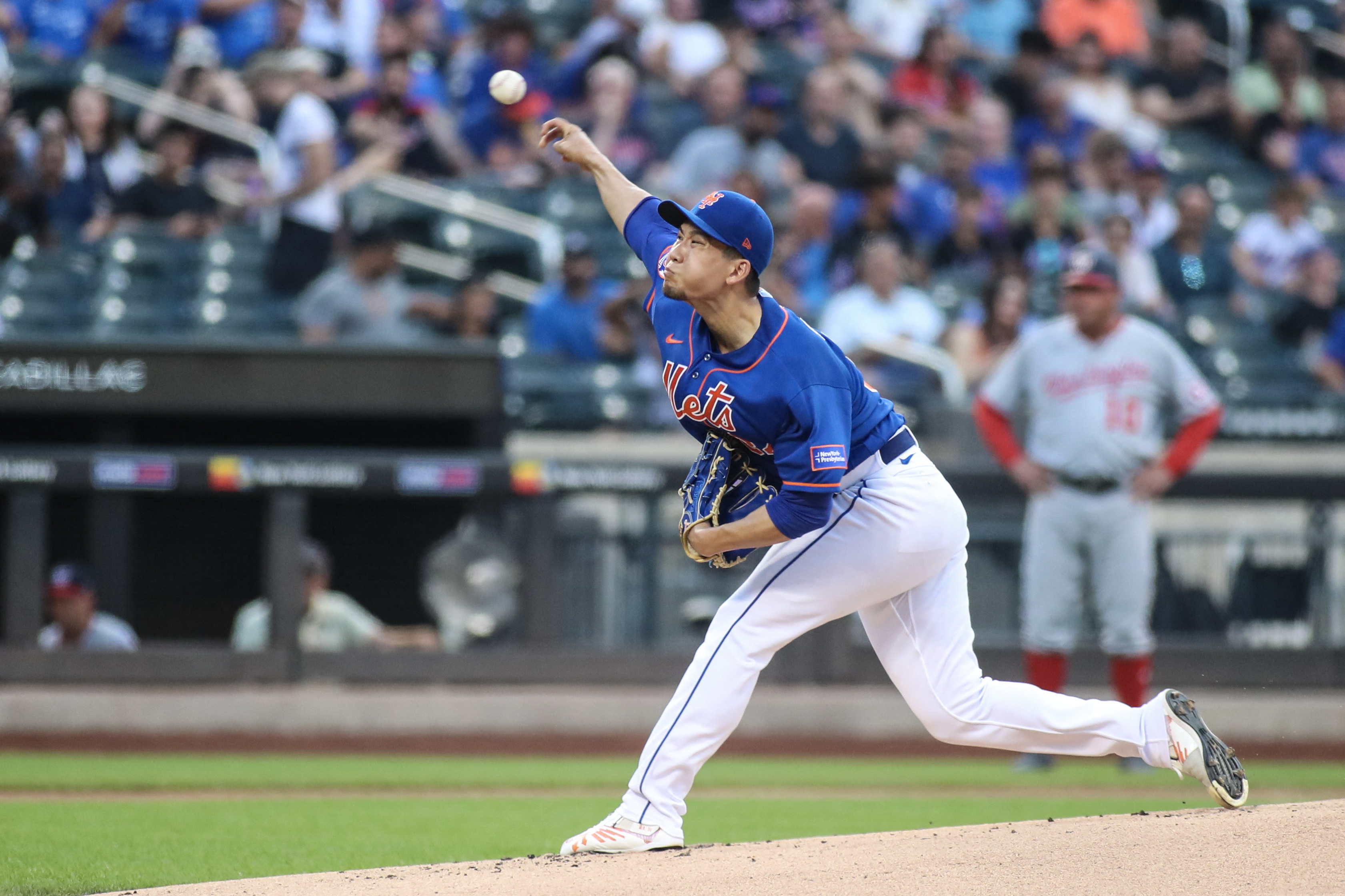 After rain delay, Mets eke out win over Nationals