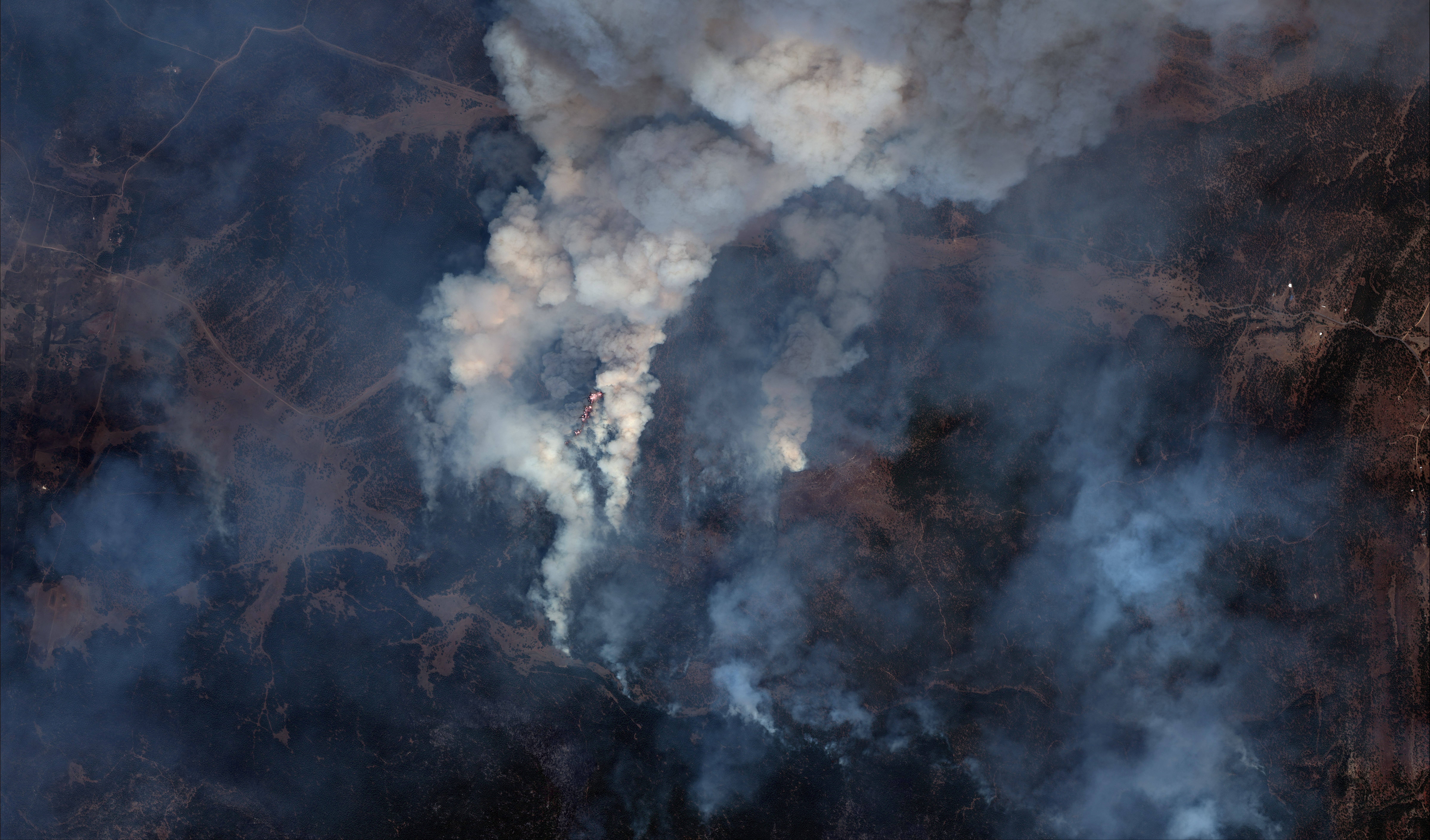 A satellite image shows a natural color  closer view of  fire lines of Hermits Peak wildfire, east of Santa Fe, New Mexico