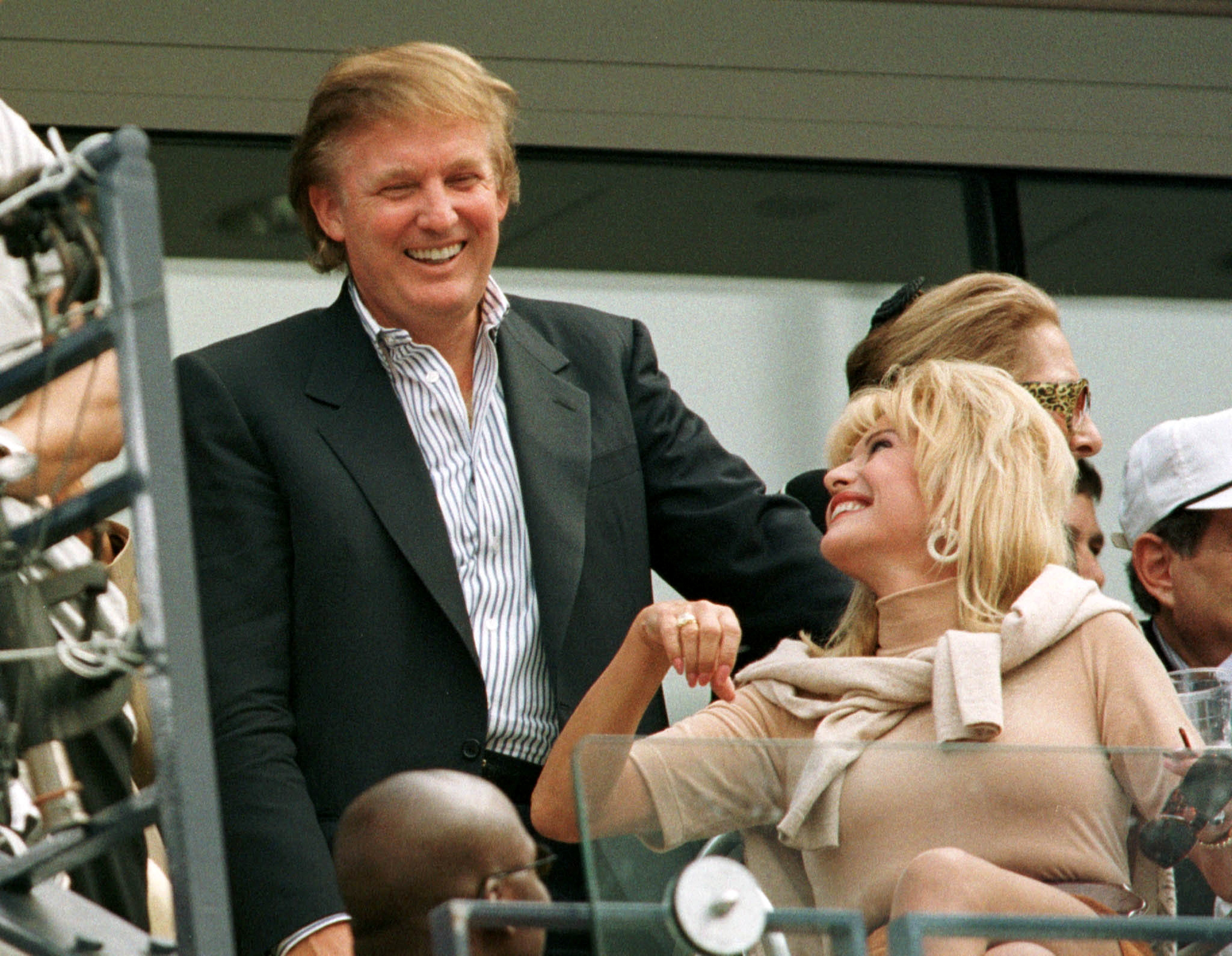 Developer Donald Trump talks with his former wife Ivana Trump during the men's final at the U.S. Open