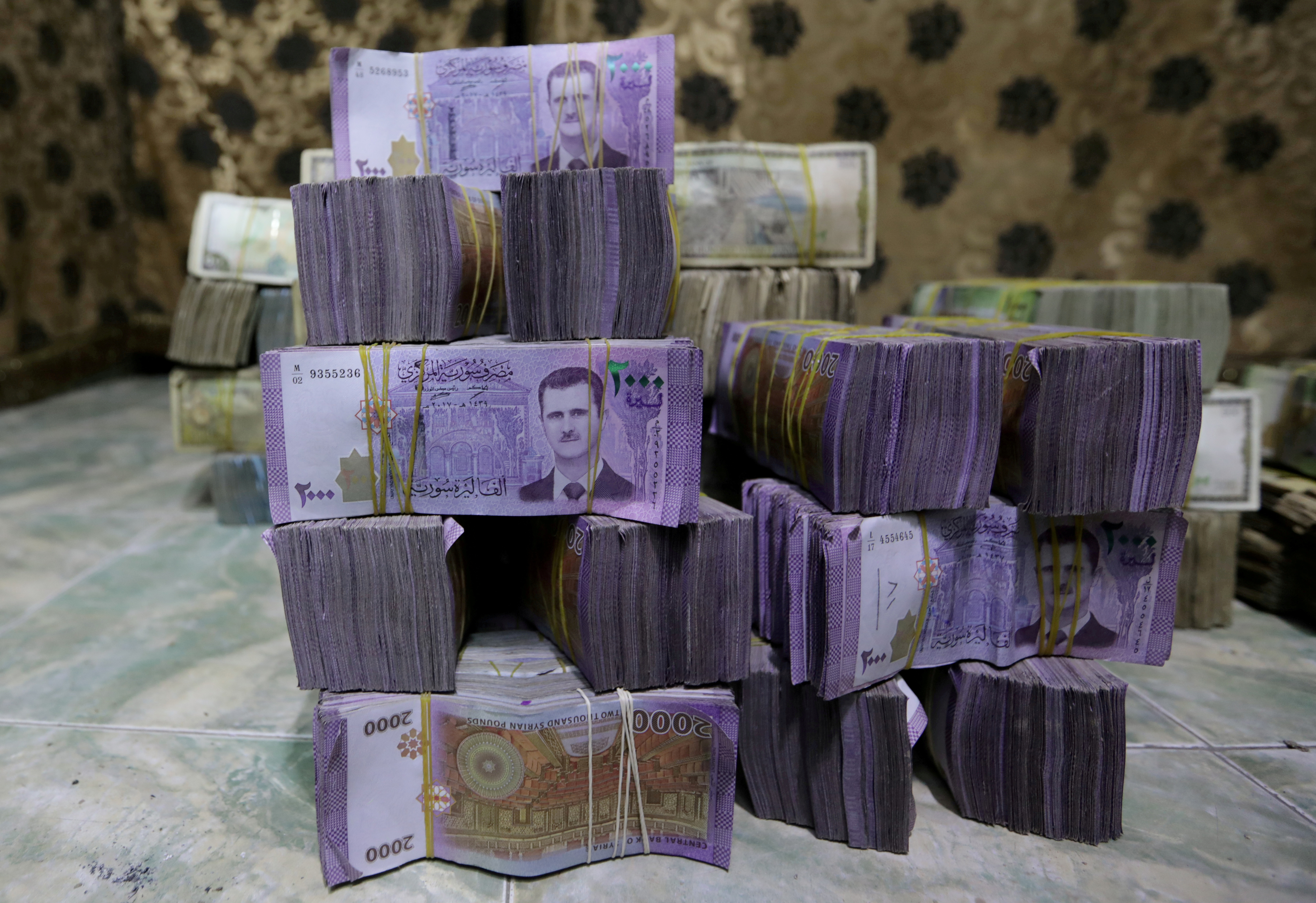 Syrian pounds are pictured inside an exchange currency shop in Azaz