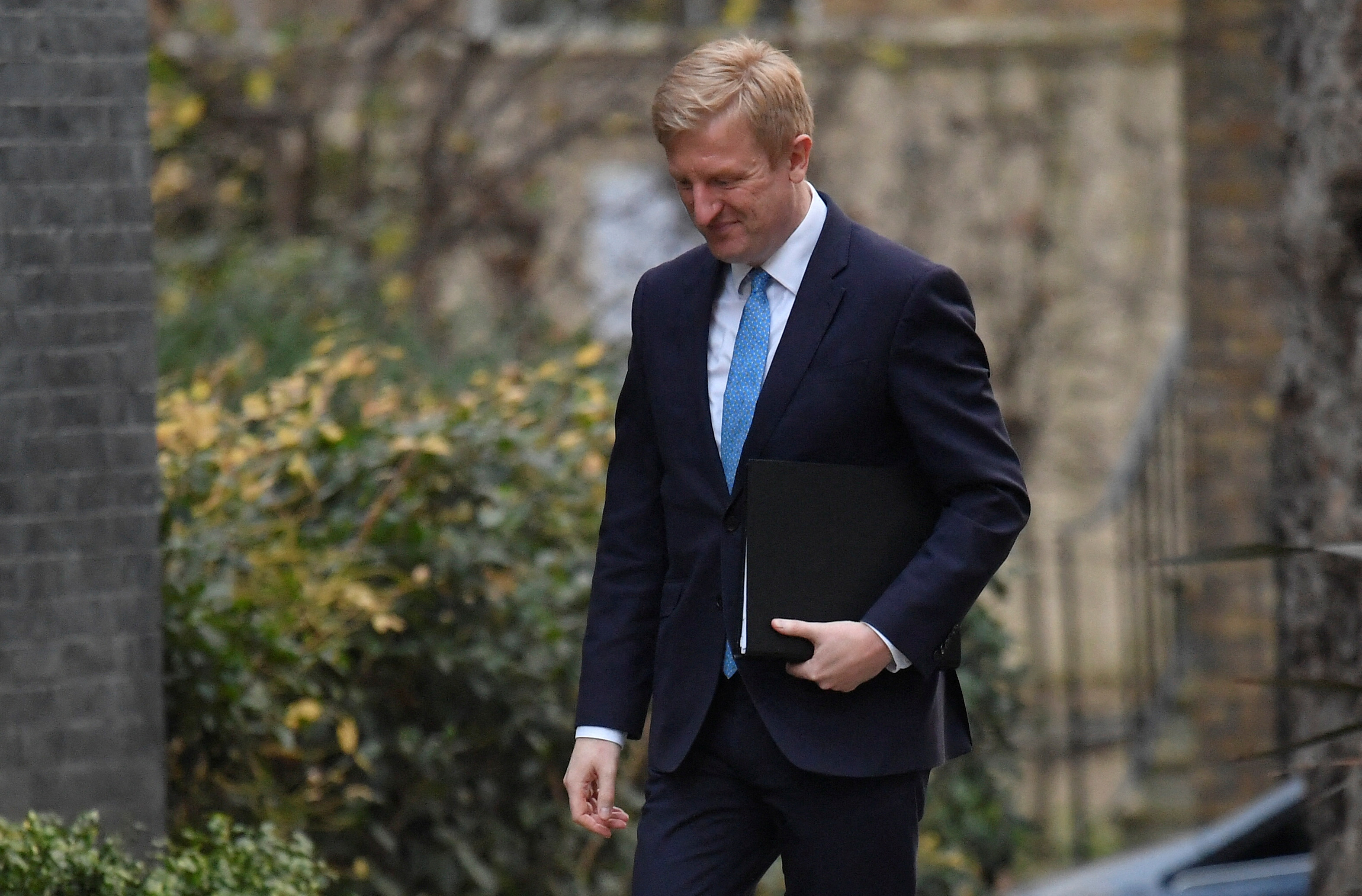 Co-Chairman of British Conservative Party Dowden walks outside Downing Street in London