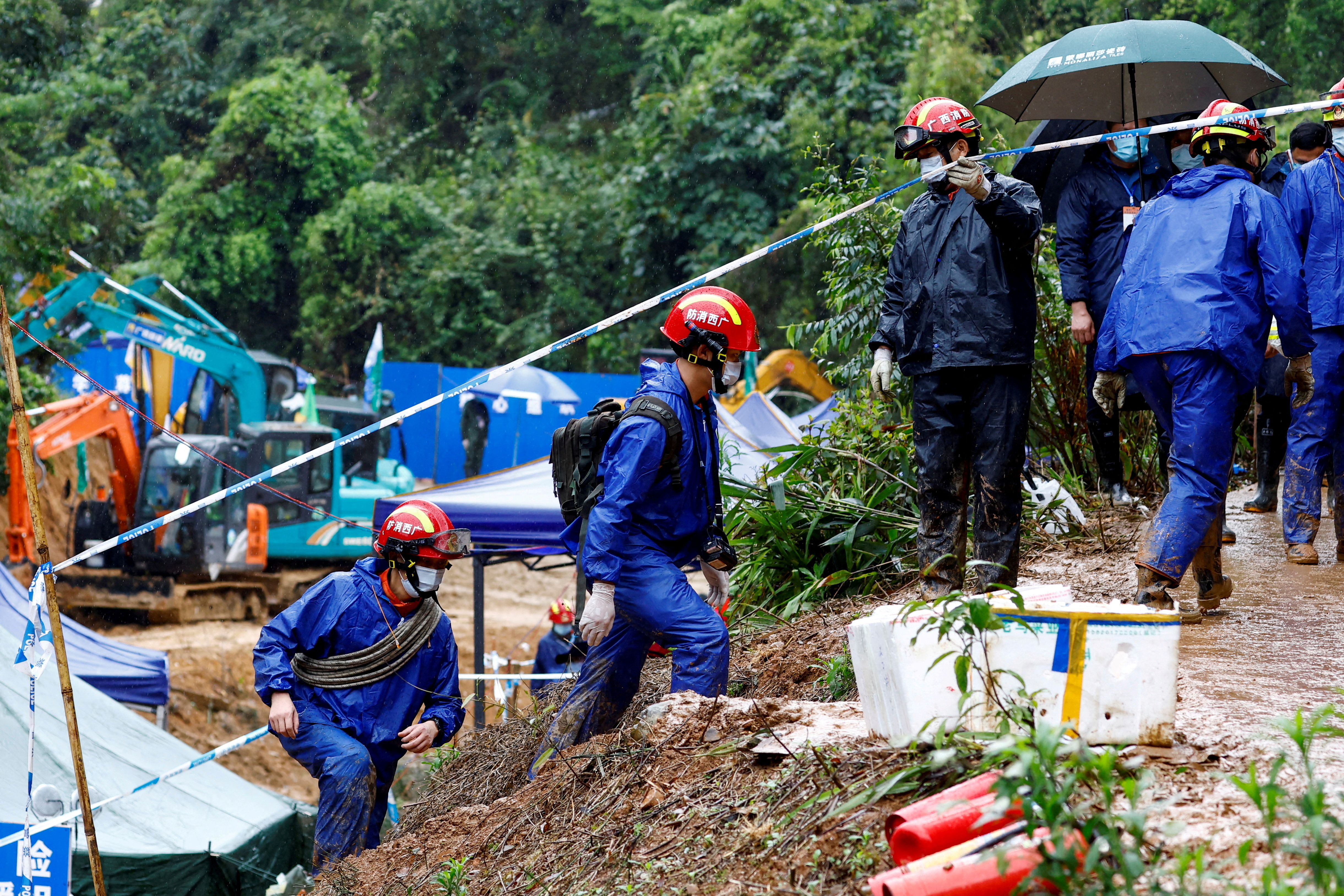 Rescuers work at the site where a China Eastern Airlines Boeing 737-800 plane flying from Kunming to Guangzhou crashed, in Wuzhou, Guangxi Zhuang Autonomous Region, Chin