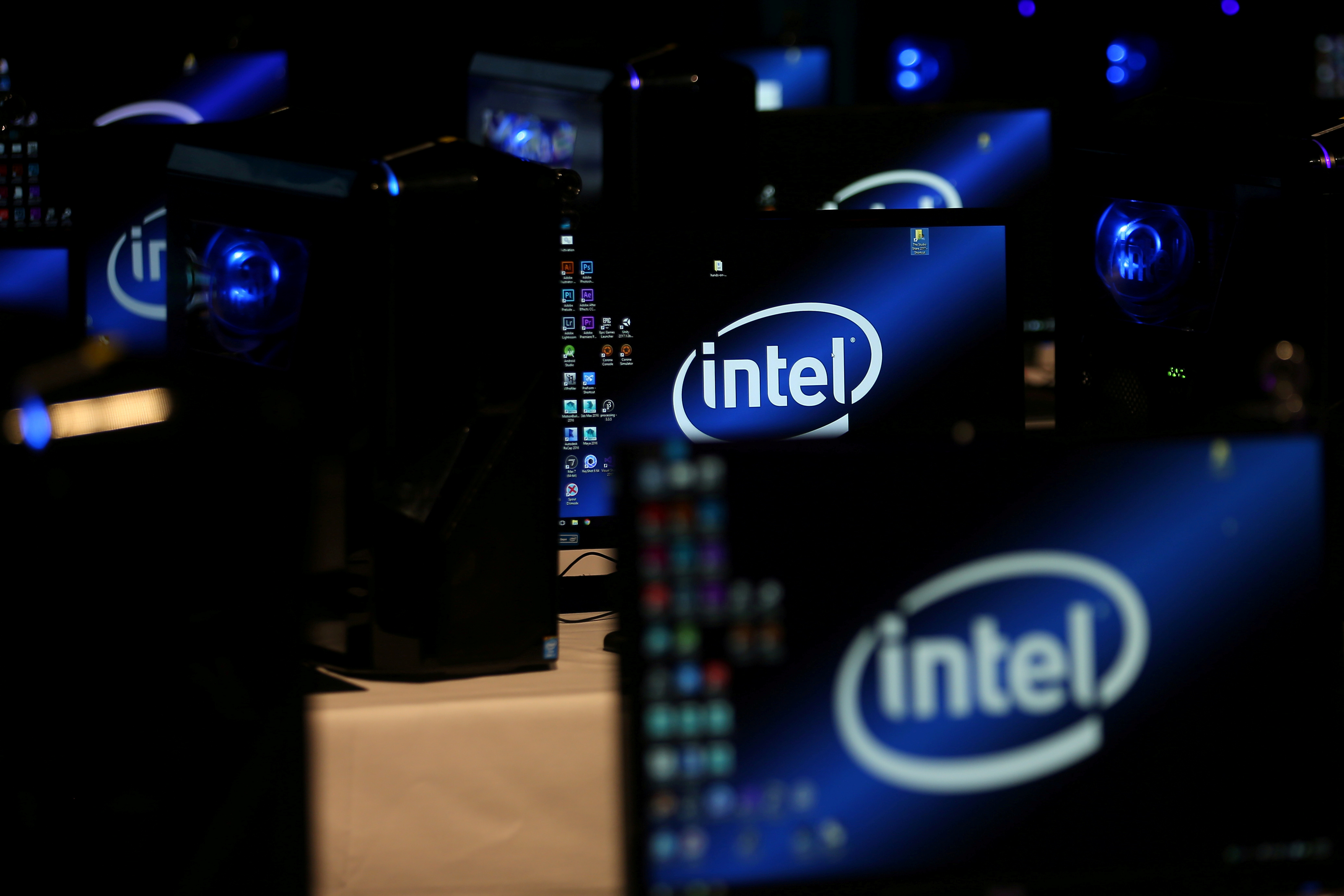 The Intel logo is displayed on computer screens