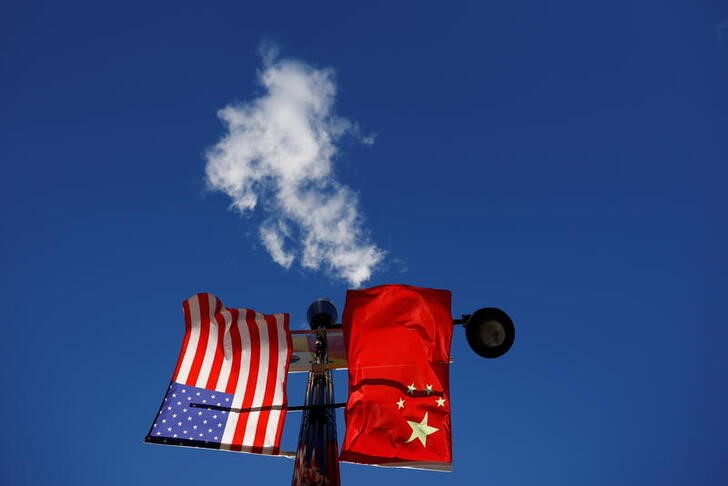 The flags of the United States and China fly in Boston