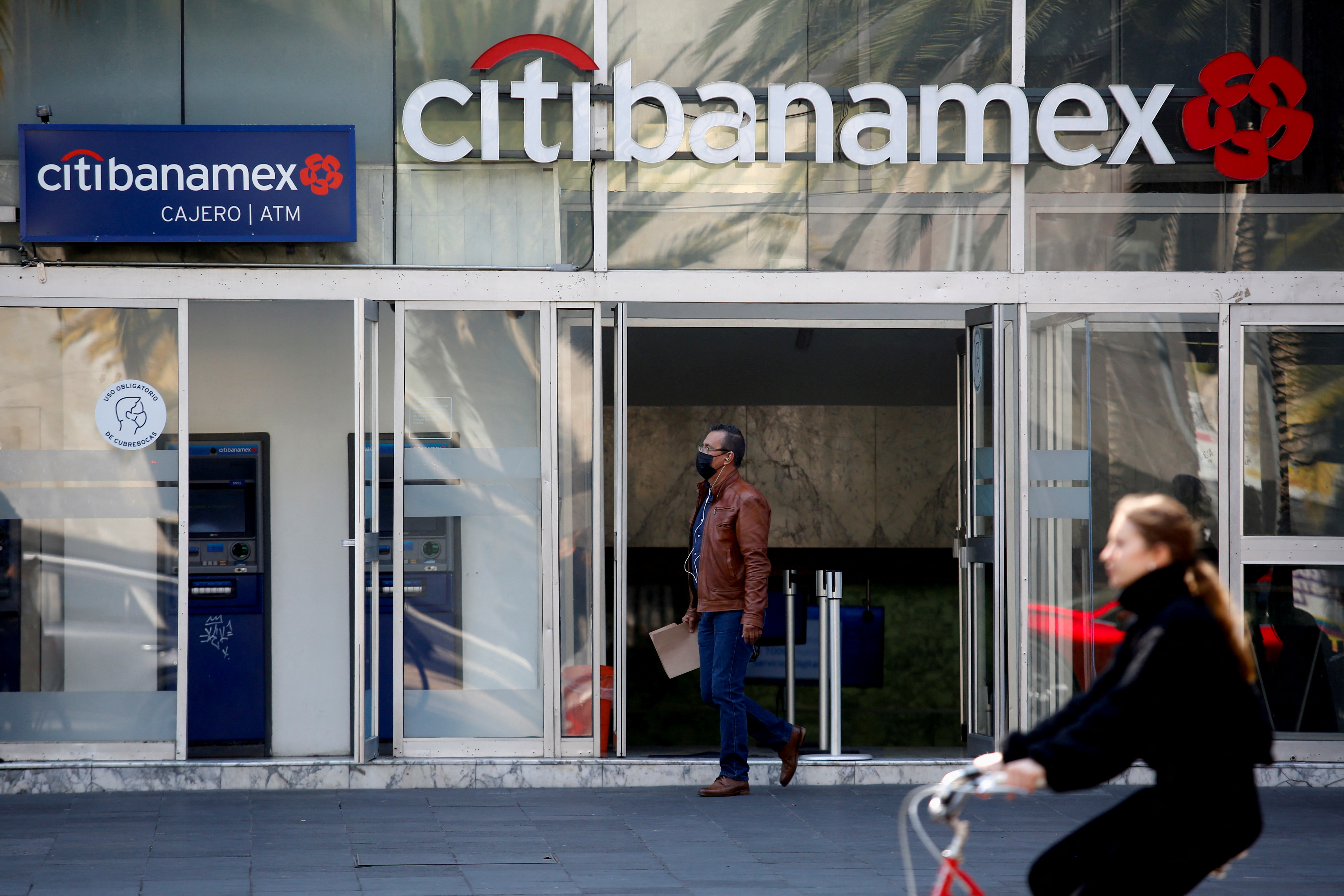 A man exits a Citibanamex bank branch in Mexico City