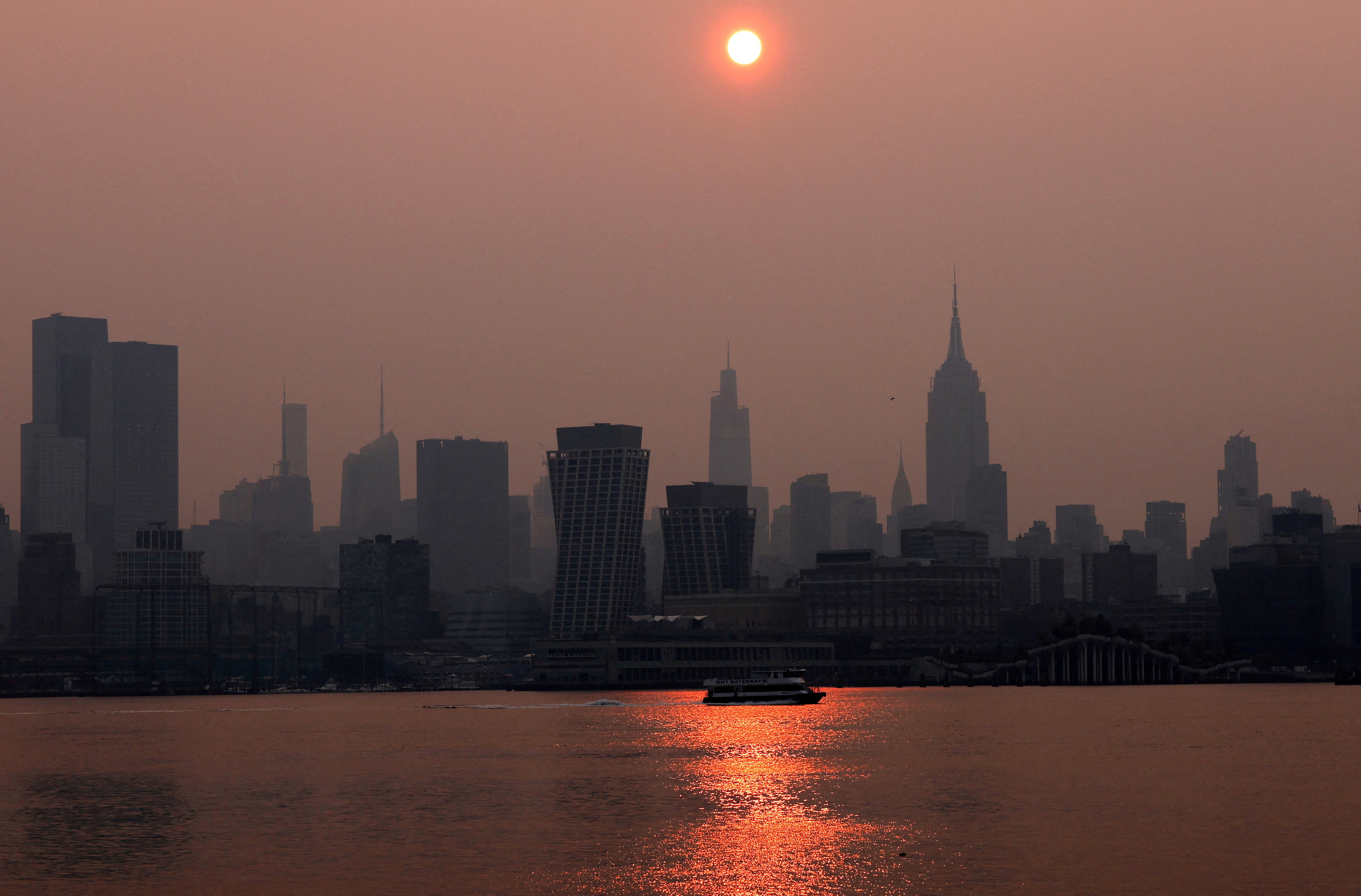 Haze and smoke from Canadian wildfires shroud Manhattan skyline in New York