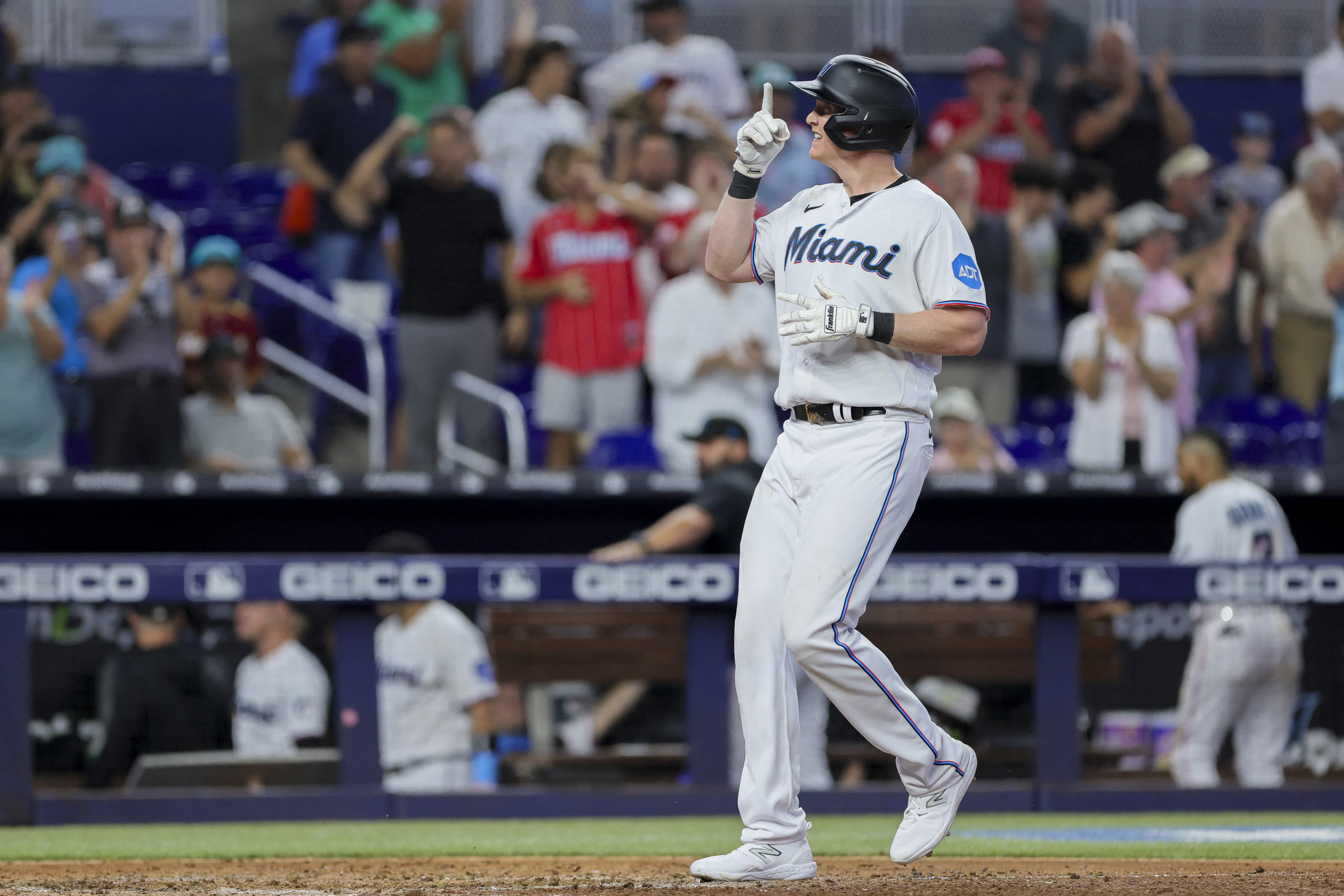 Marlins' Garrett Cooper reacts to his game-winning grand slam to sweep  Tigers 