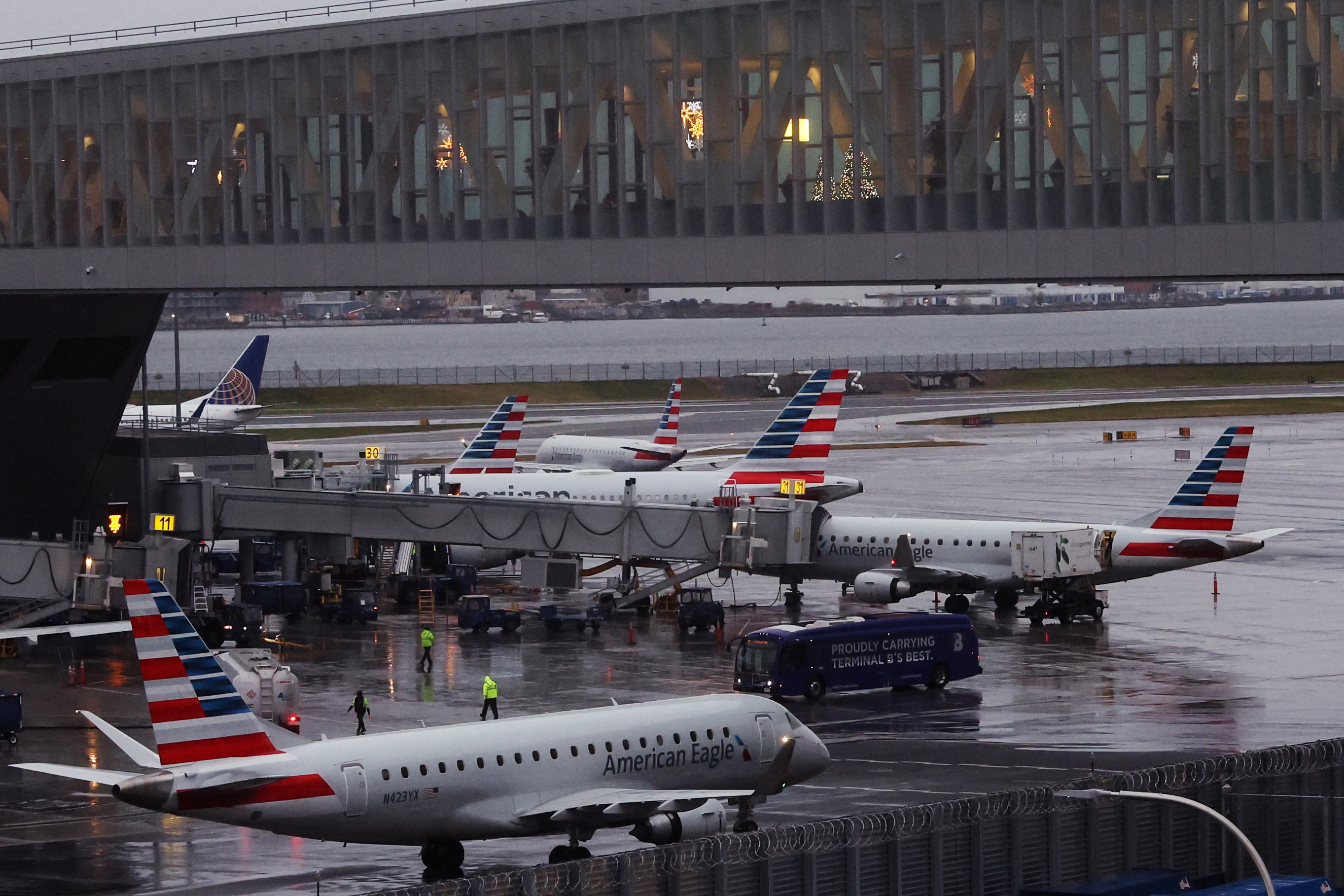 American Airlines planes are seen at gates at LaGuardia Airport ahead of the Thanksgiving holiday, in New York City