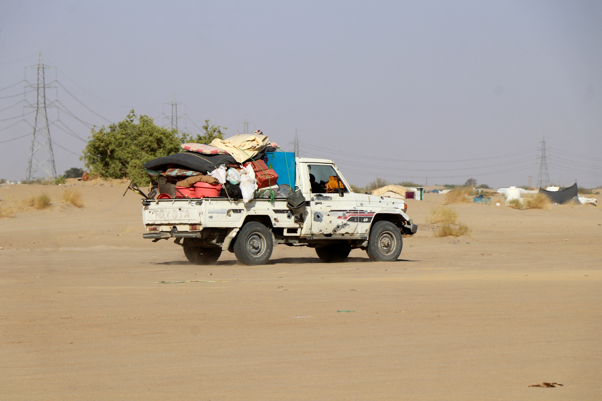 Truck loaded with furniture is pictured near a camp for internally displaced people (IDPs) in Marib, Yemen