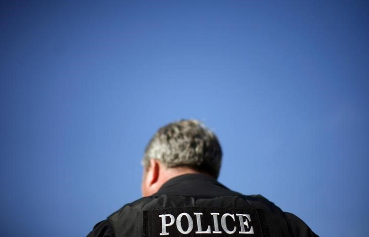 A police officer looks on outside the Sandra Day O'Connor United States Courthouse in Phoenix, Arizona