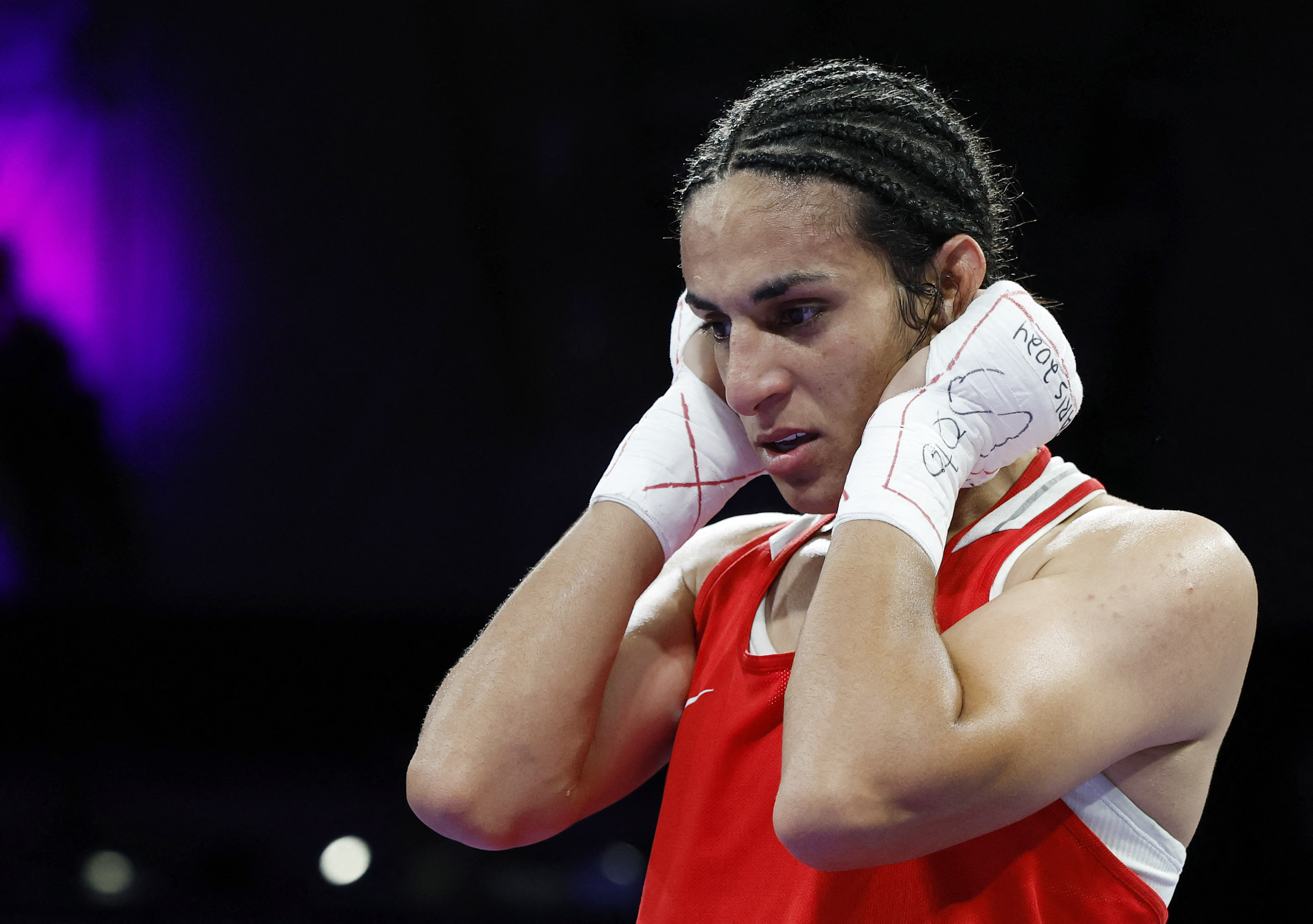 Algeria's Khelif beats Hungarian Hamori to ensure medal amid boxing gender  row | Reuters